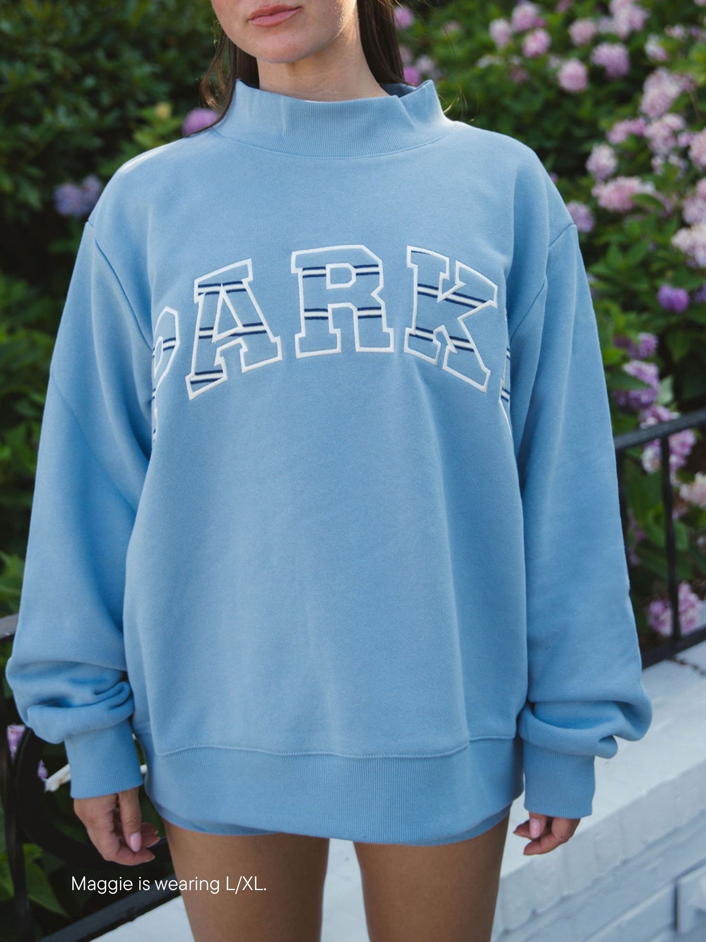 girl wearing Maggie & Emma Heritage Varsity Mockneck -sky