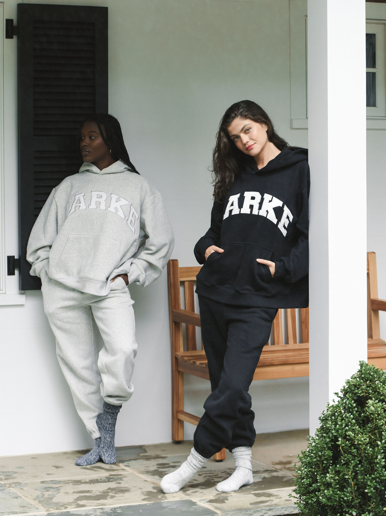 model wearing varsity hoodie sweatshirt - classic grey + white