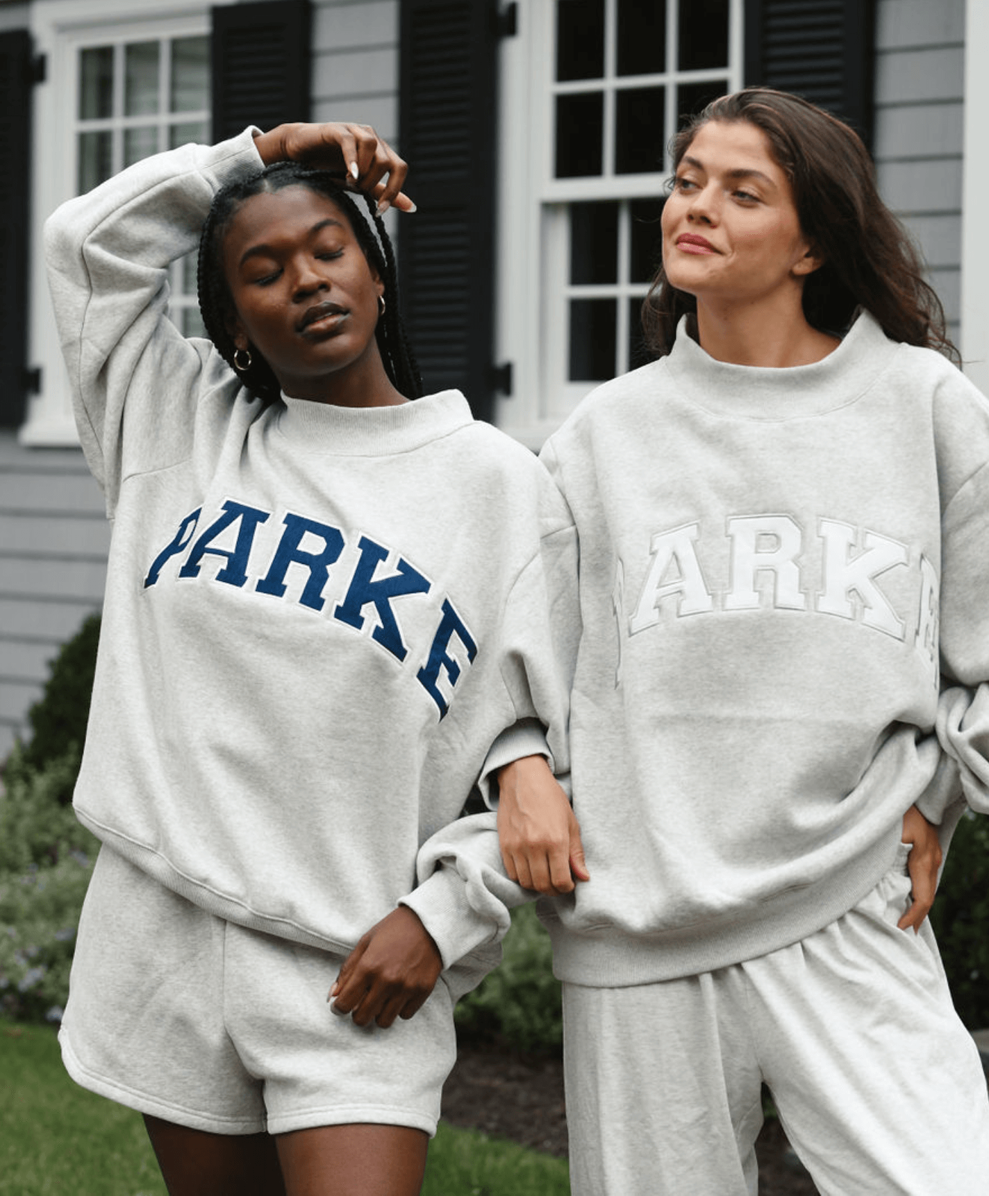 model wearing classic grey + navy sweatshirt -classic grey + navy