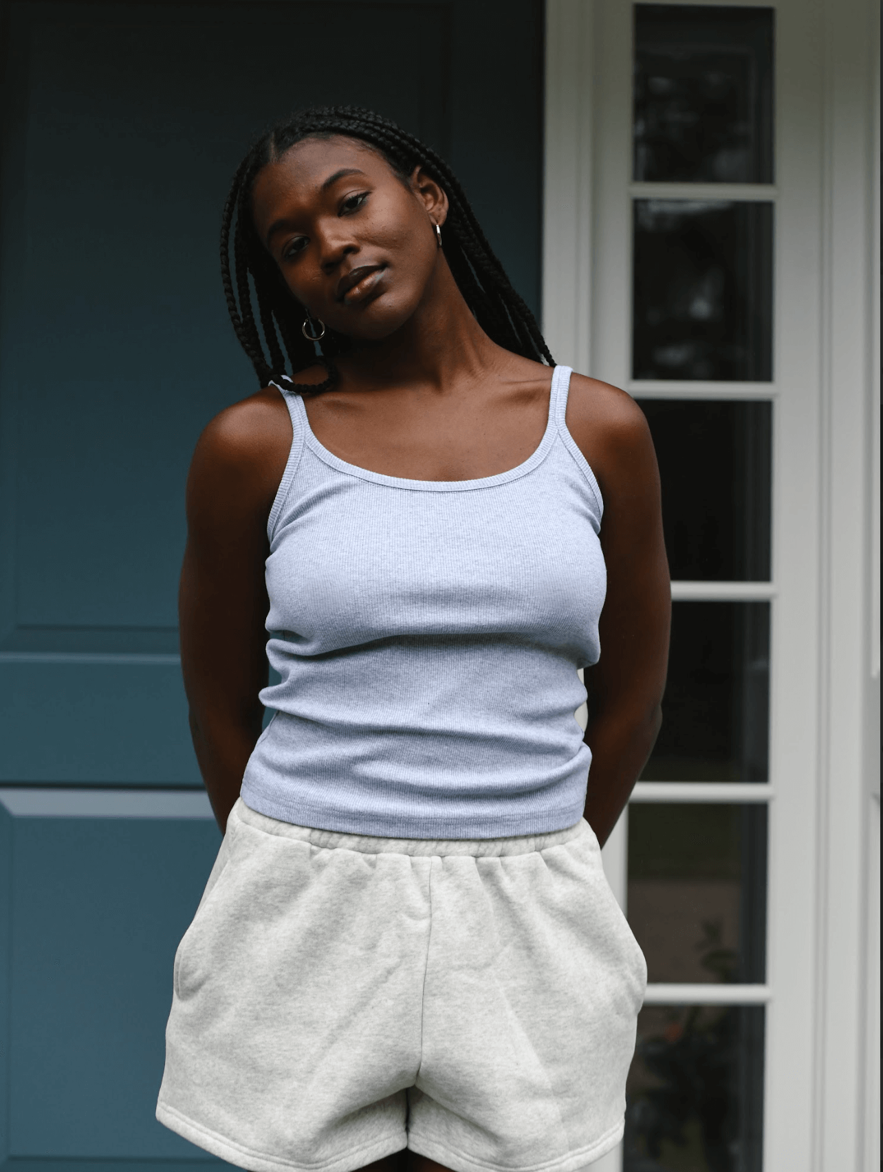 model wearing thin strap tank - grey