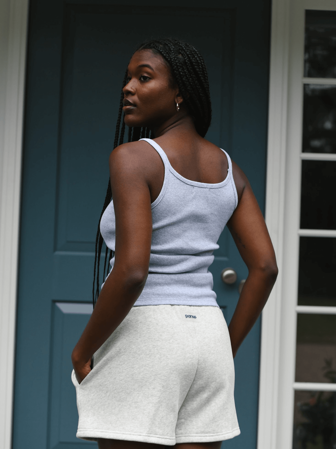 model wearing thin strap tank - grey