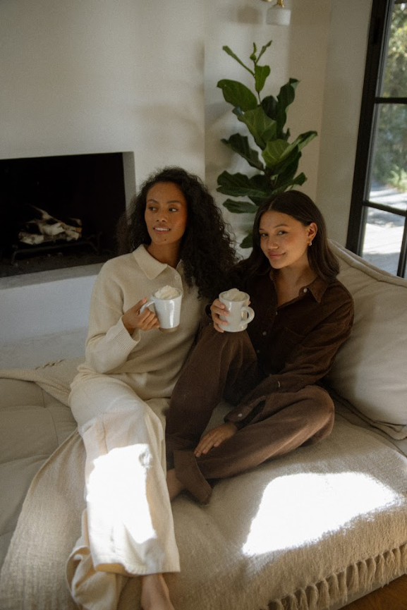 girls sitting on couch wearing cream corduroy classic straight pant - cream