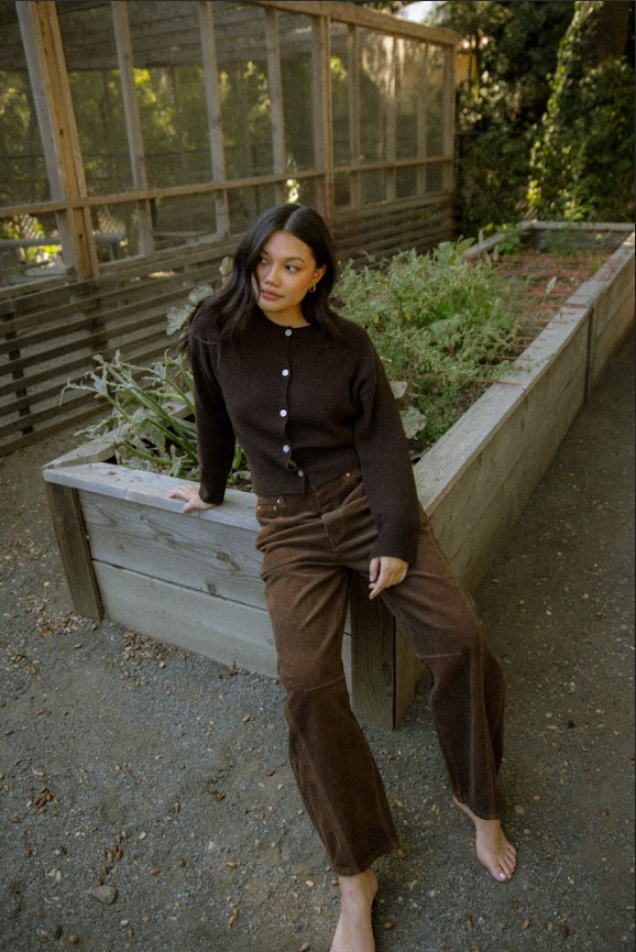 girl sitting wearing chocolate brown cardigan -chocolate