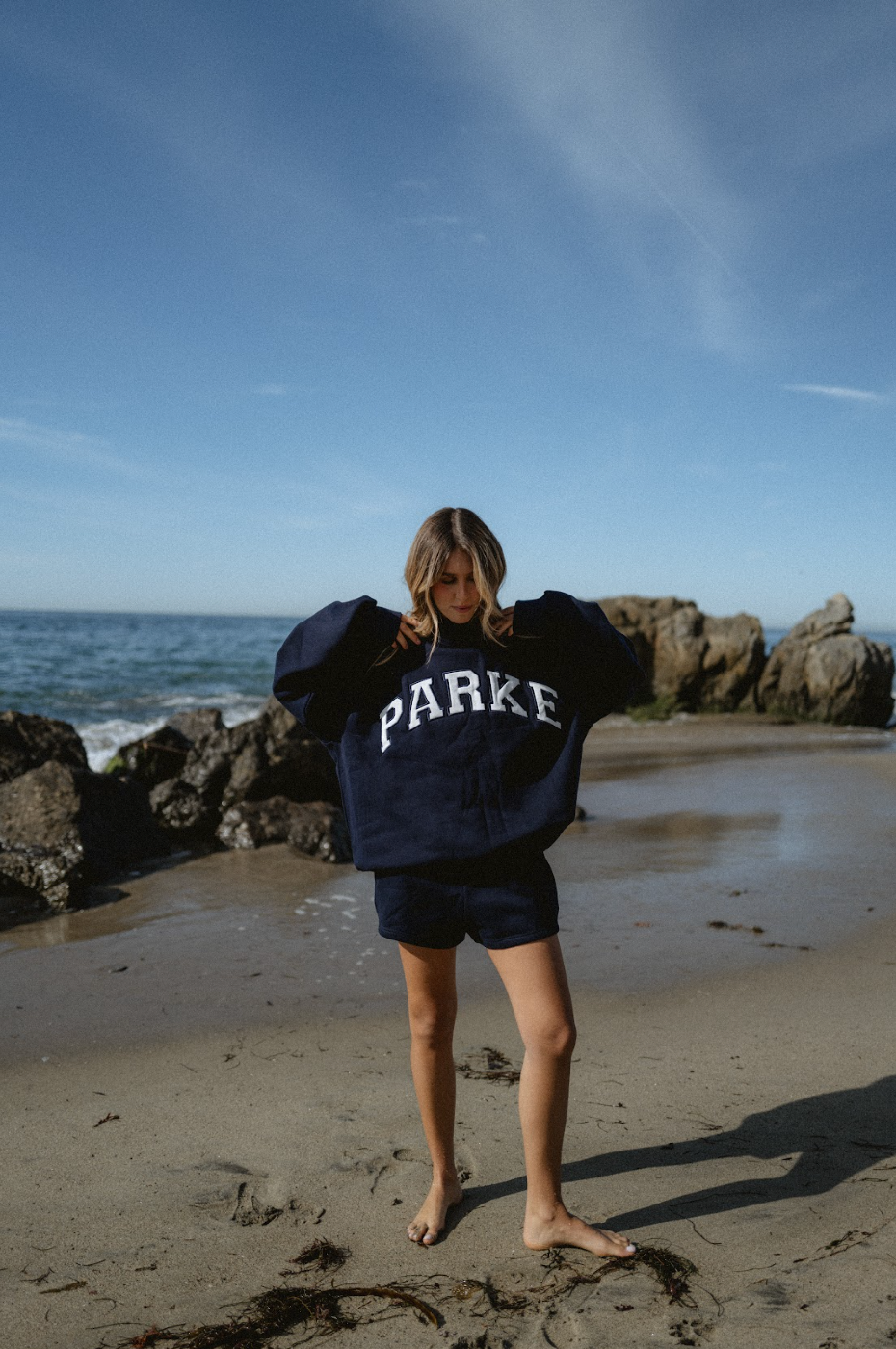 model wearing varsity mockneck -navy + white