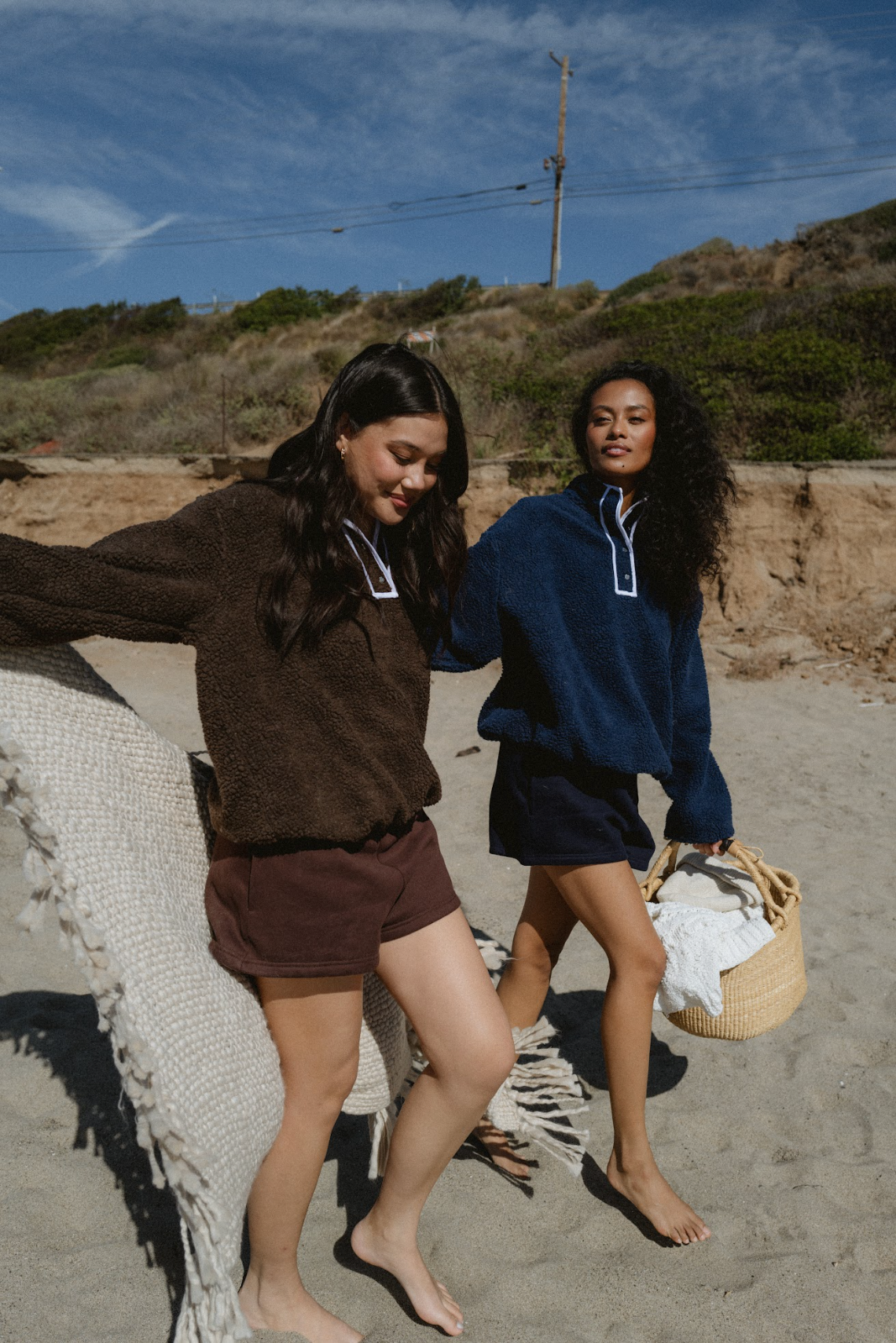 model wearing navy and chocolate brown fleece- navy