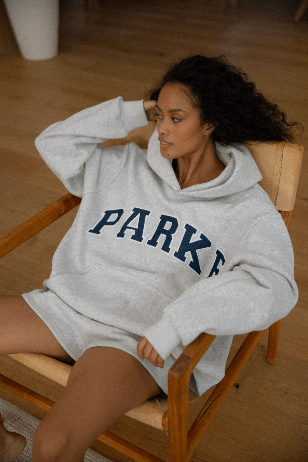 model wearing varsity hoodie -classic grey + navy