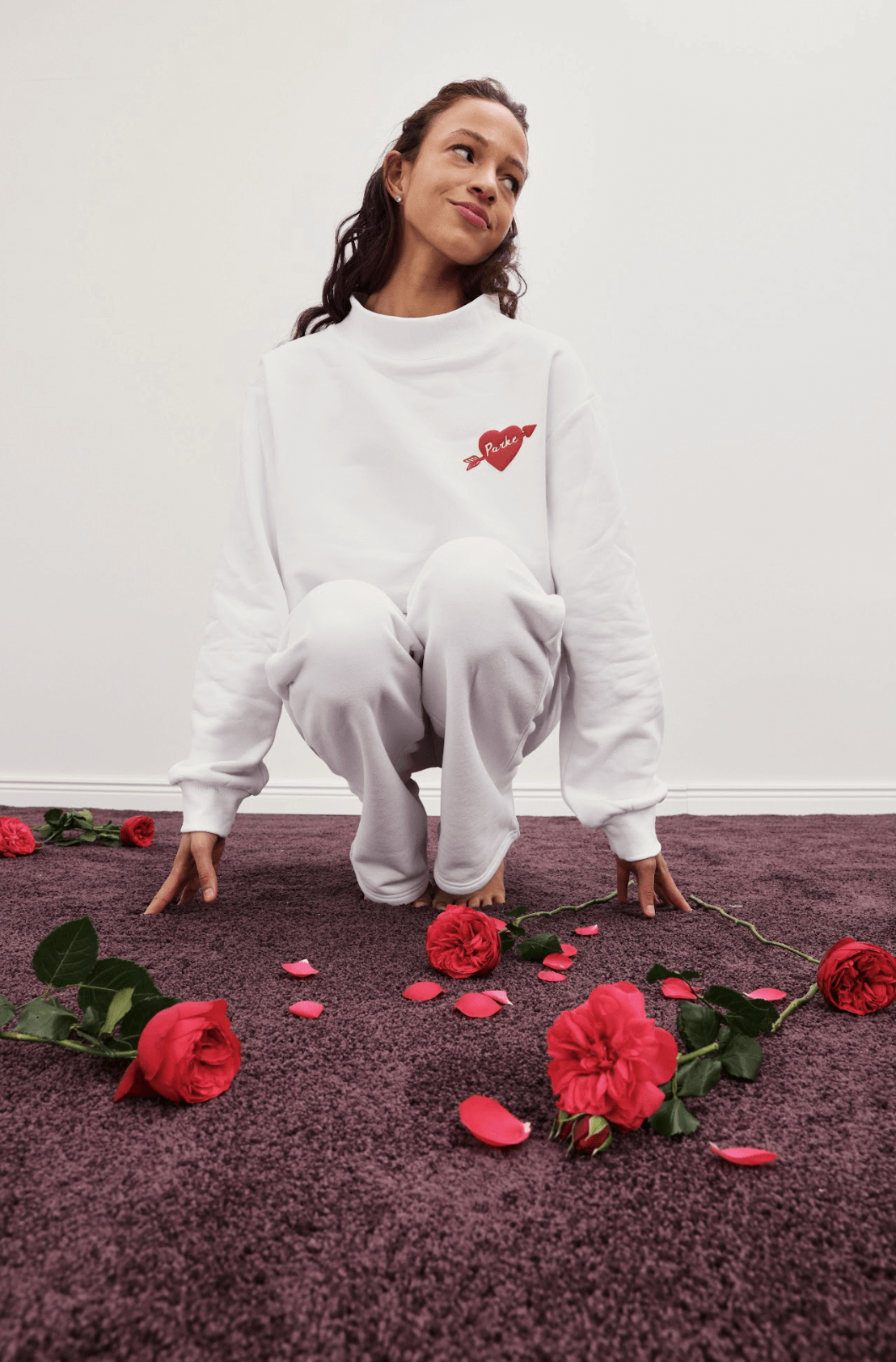 girl wearing cupid mockneck -white