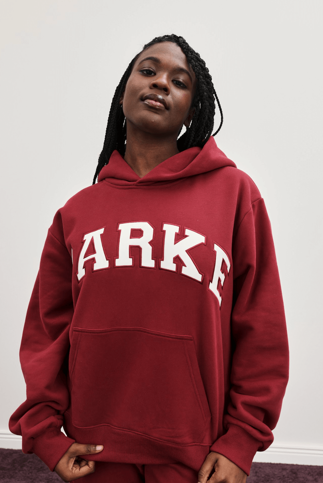 girl wearing varsity hoodie -burgundy + white