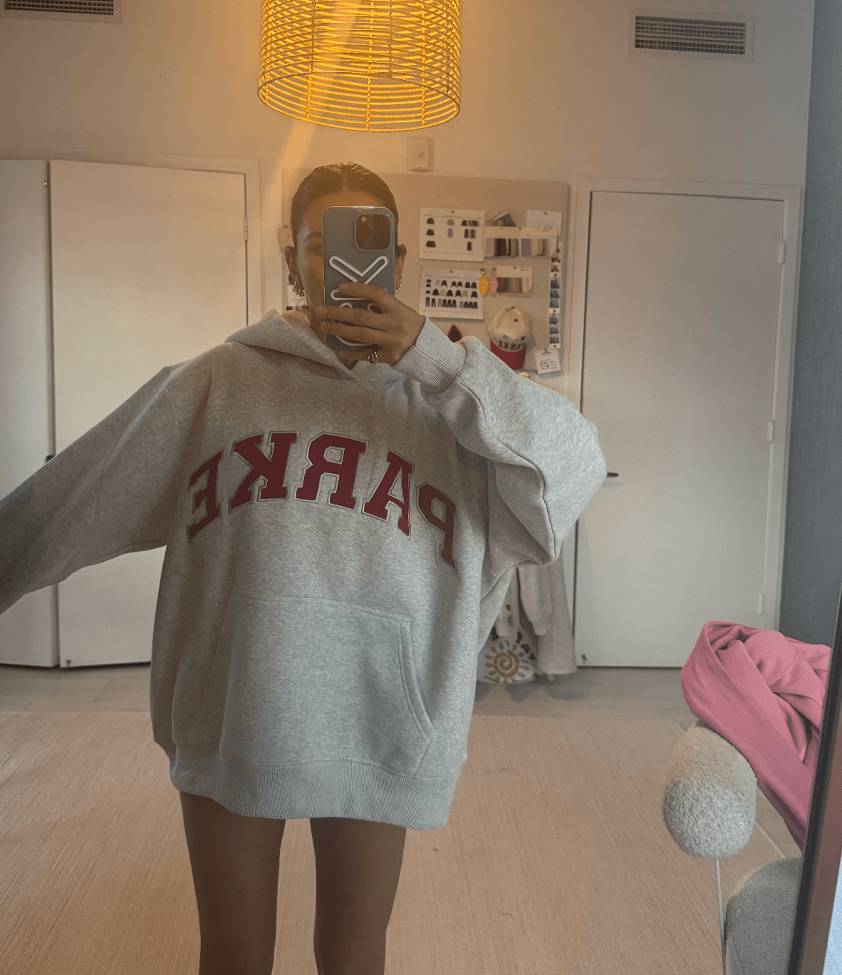 girl wearing varsity hoodie -classic grey + ruby