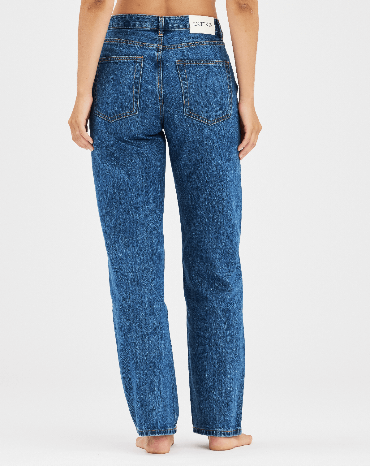 girl wearing med wash classic straight jean -medium wash