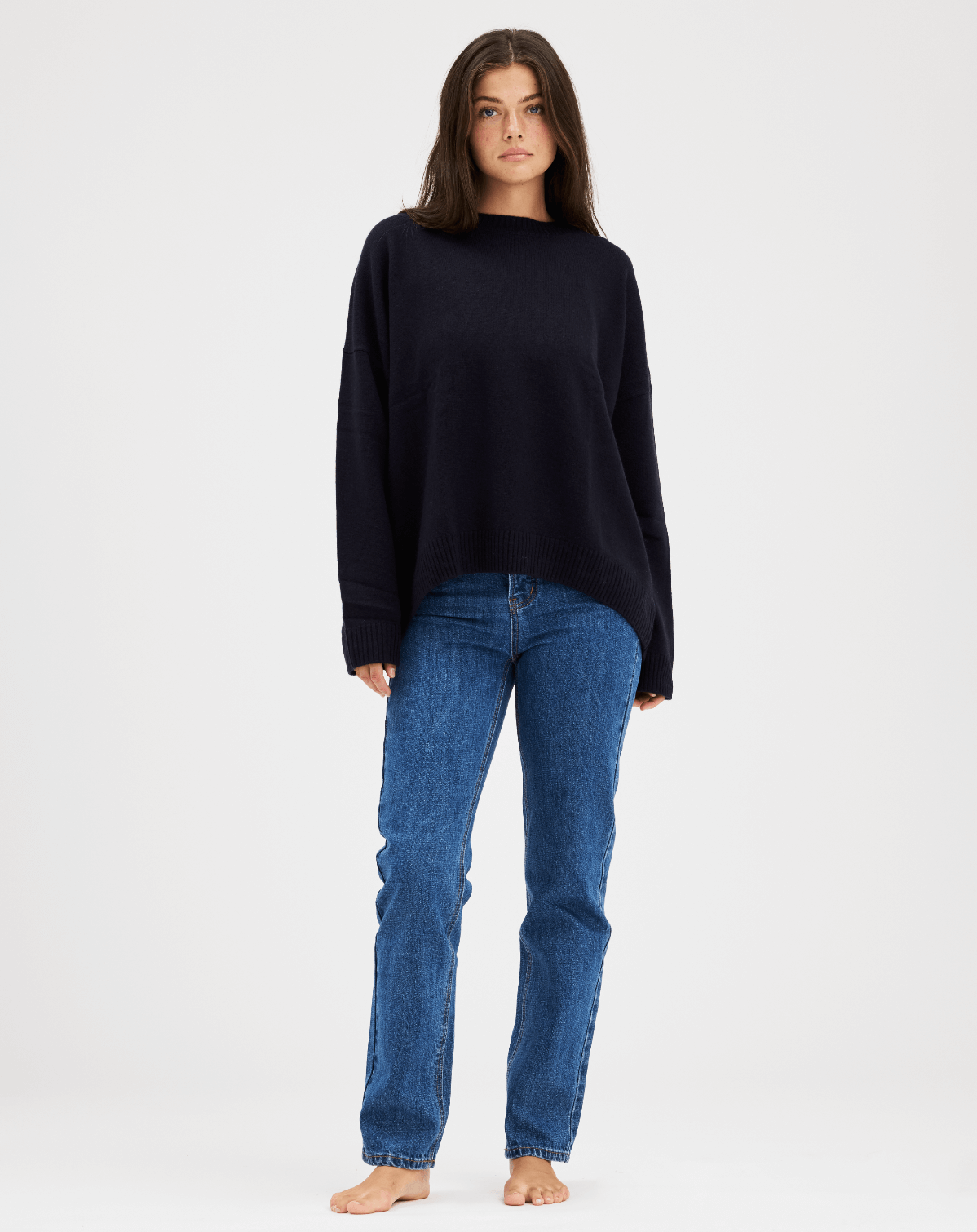 girl showing front of navy oversized pullover sweater -navy