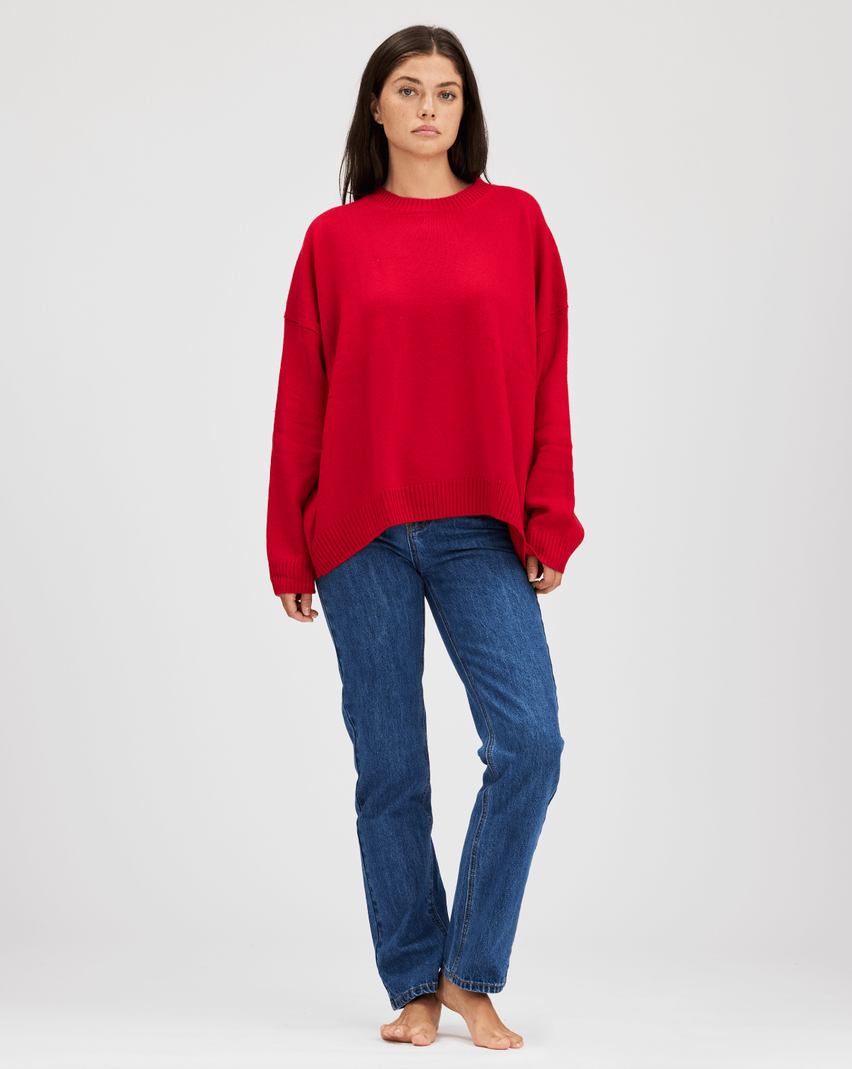 girl showing front of oversized pullover sweater -cherry