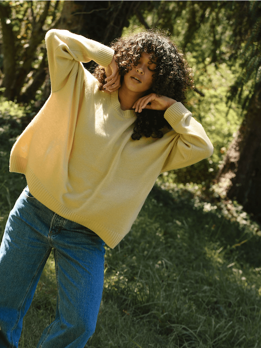girl showing front of honey oversized pullover sweater -honey