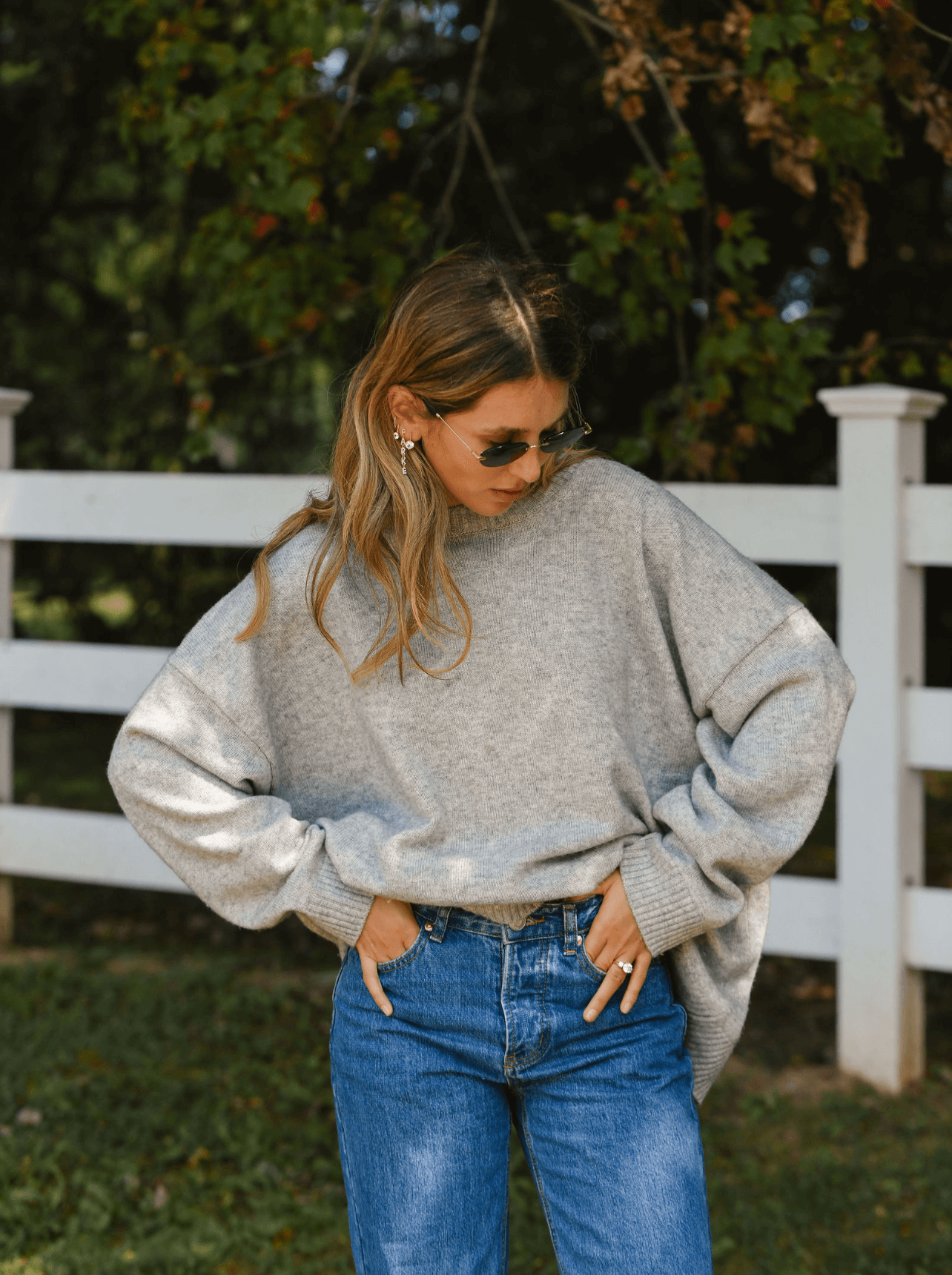 girl wearing heather grey oversized pull over sweater -heather grey