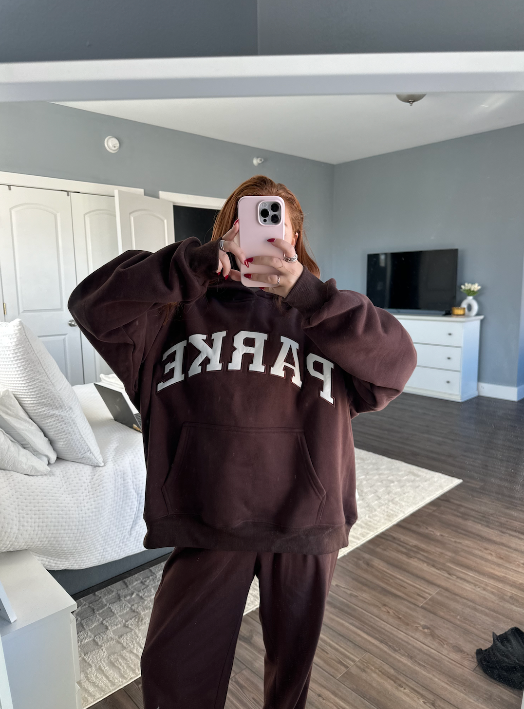 model wearing varsity hoodie sweatshirt - chocolate brown + white