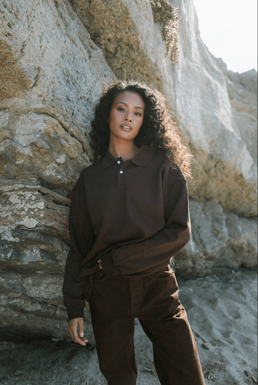 girl showing front of long sleeve polo - chocolate