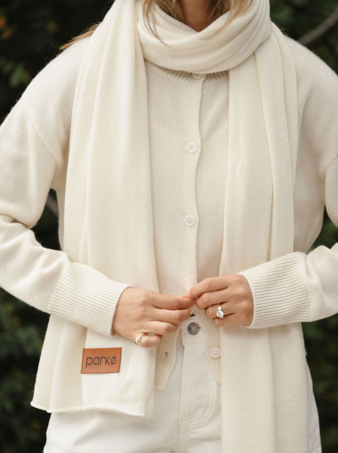 girl wearing cream cashmere scarf - chocolate