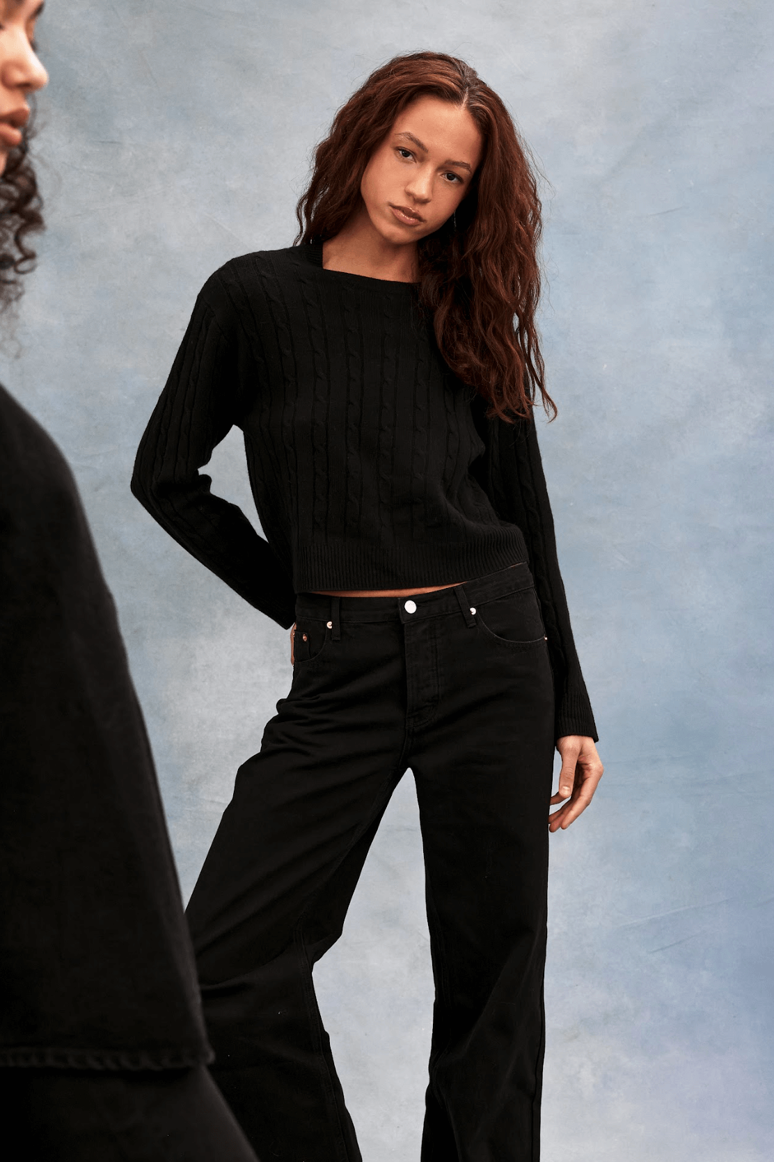 girl wearing black cable knit sweater - black