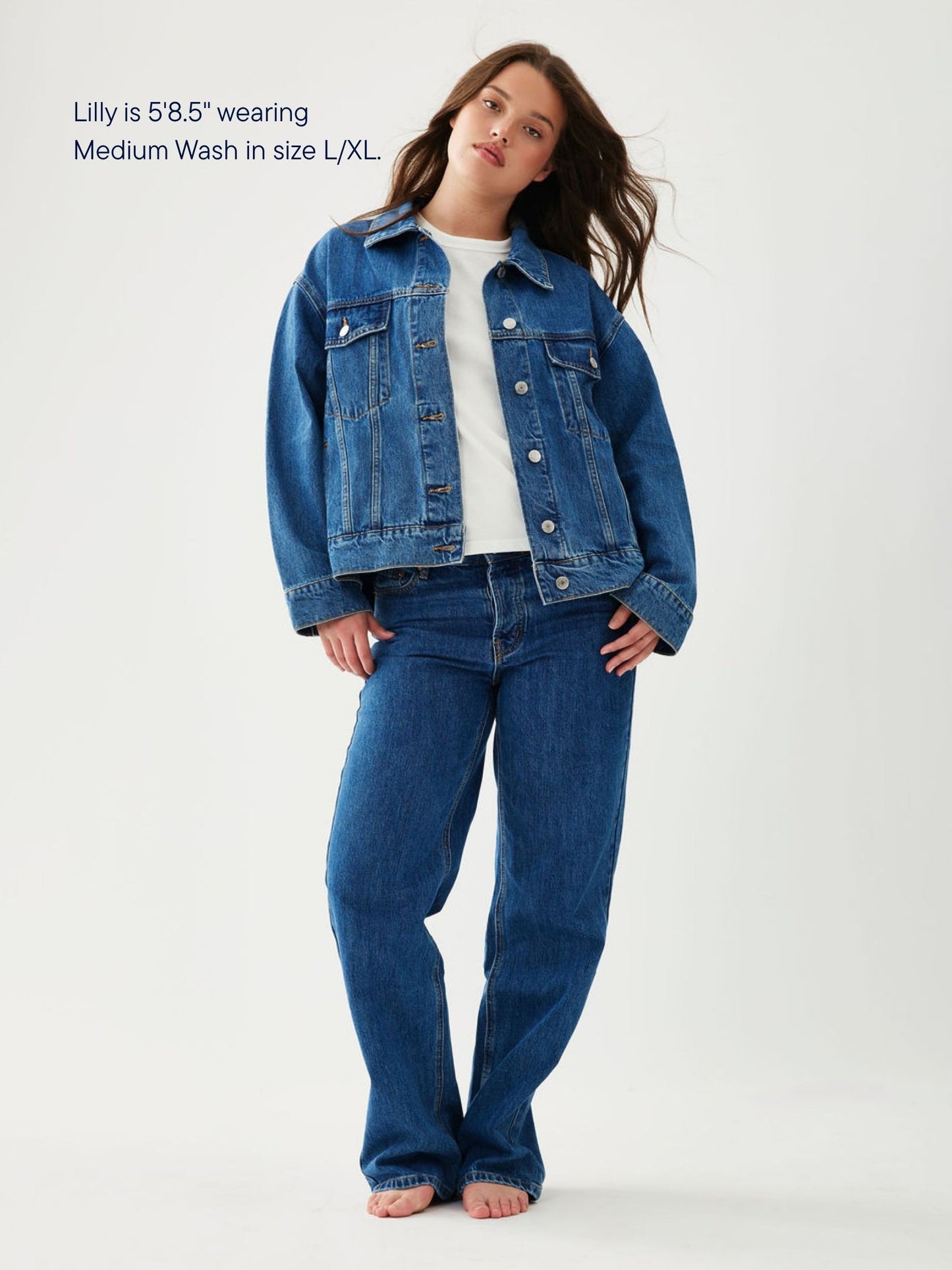 girl wearing oversized denim jacket -medium wash