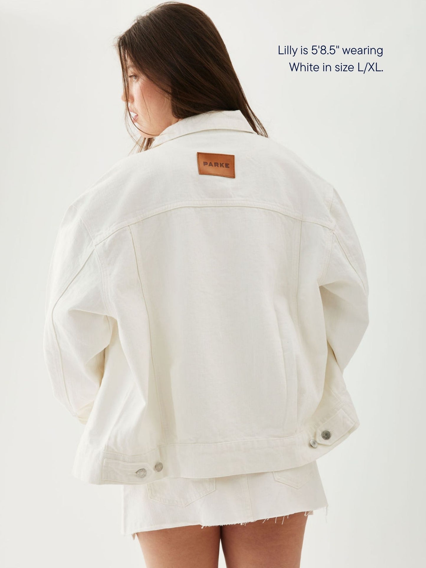 girl wearing oversized denim jacket -white