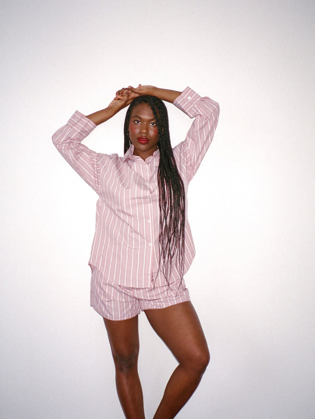 girl wearing dark pink stripe boyfriend button down- dark pink stripe