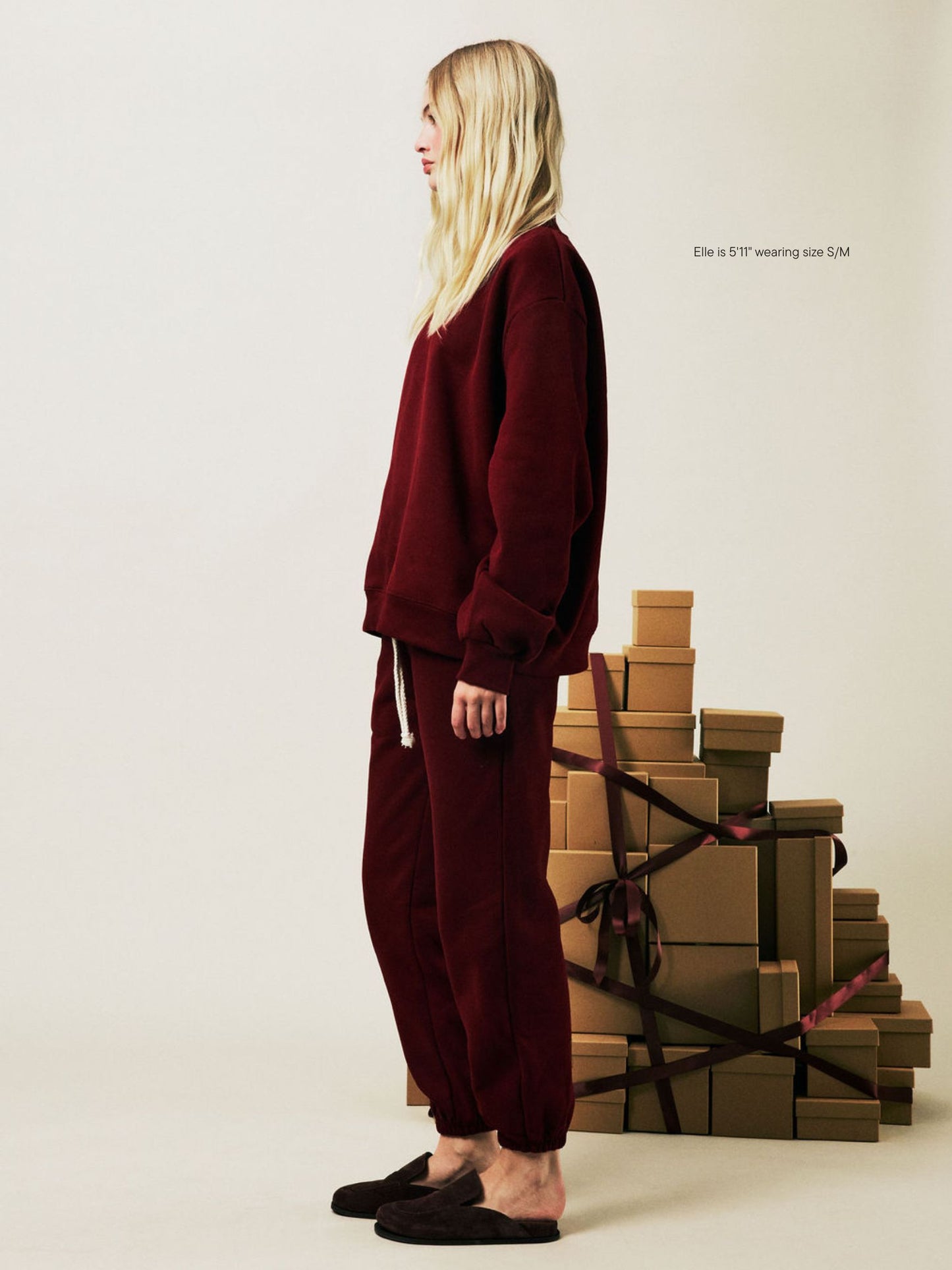 girl wearing Holiday Drawstring Unisex Sweatpants -maroon