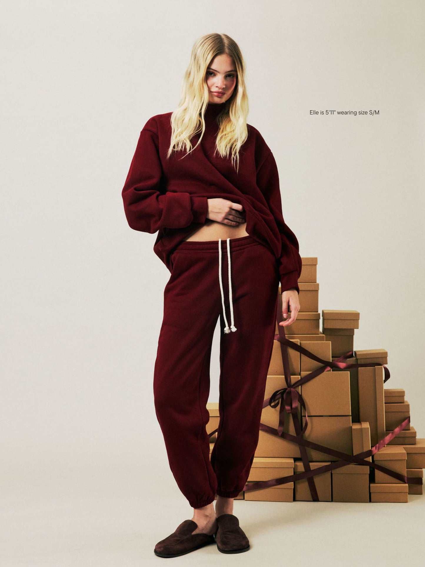 girl wearing Holiday Drawstring Unisex Sweatpants -maroon