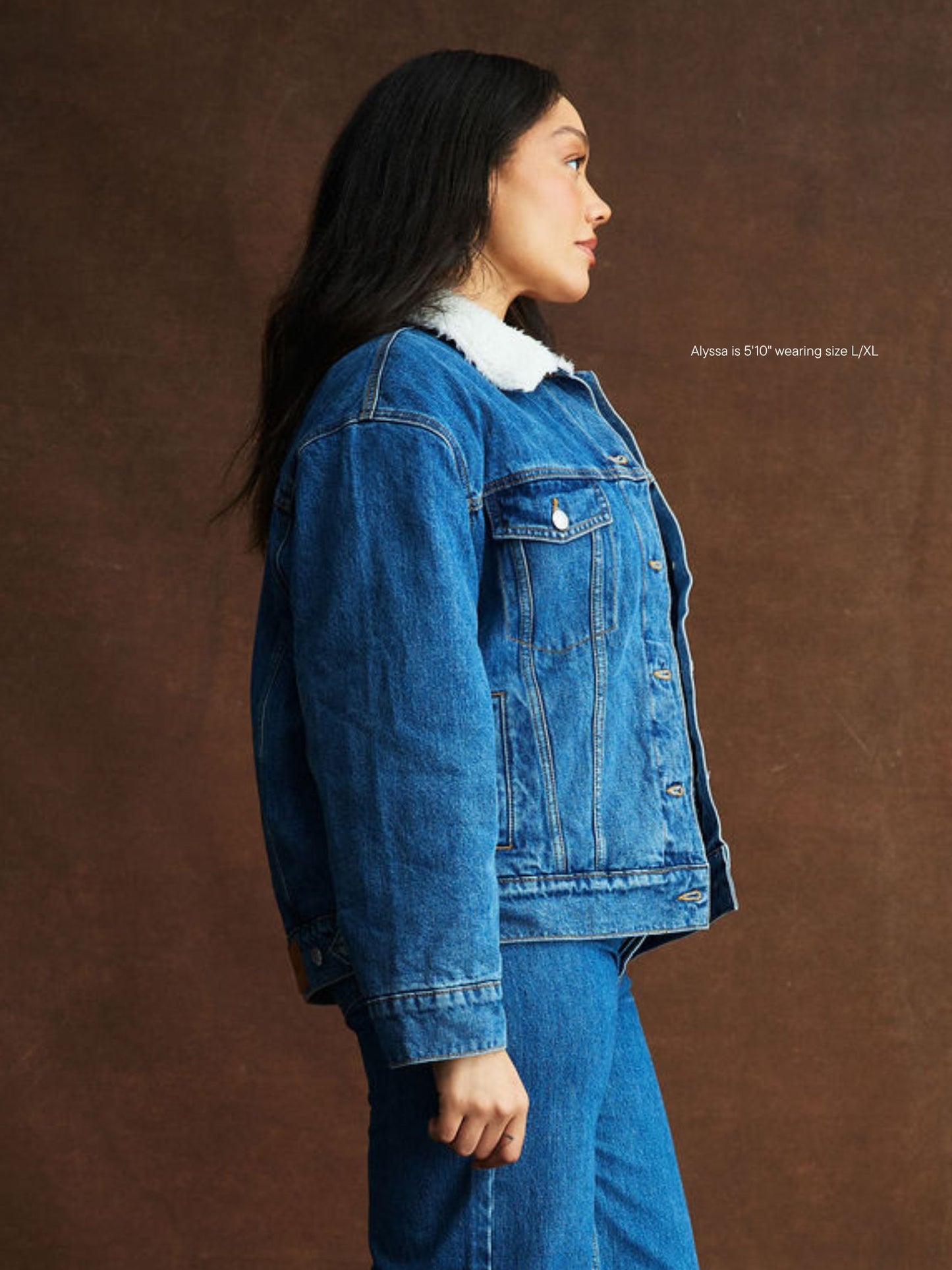 girl wearing Oversized Sherpa Lined Denim Jacket -medium wash