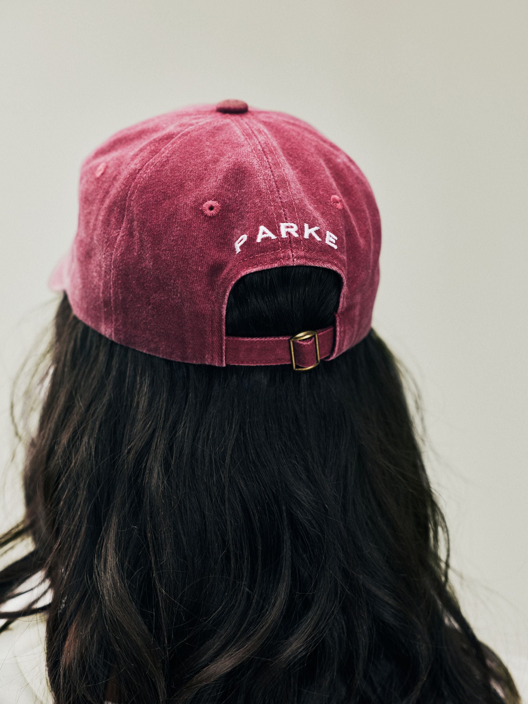 girl wearing Holiday P Hat -washed maroon + plaid p