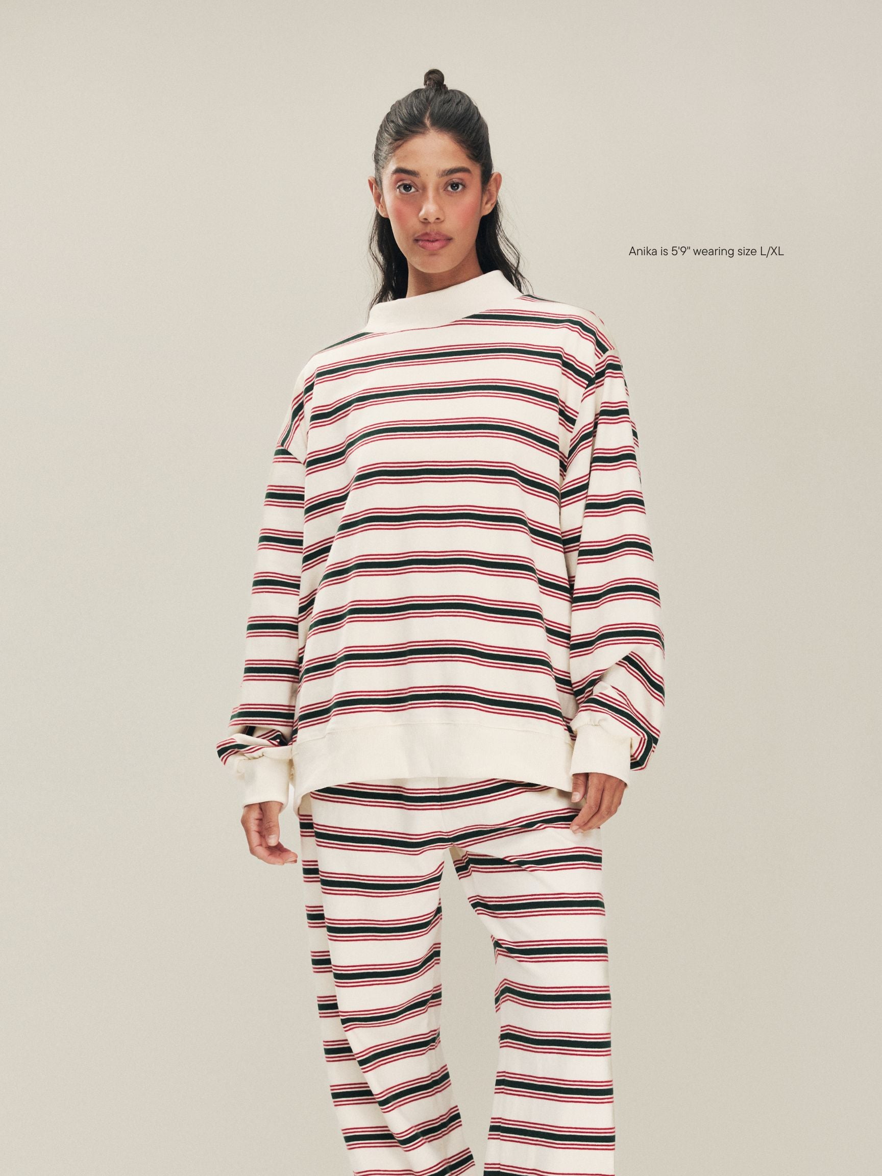 girl wearing Holiday Striped Pullover -eggnog stripe
