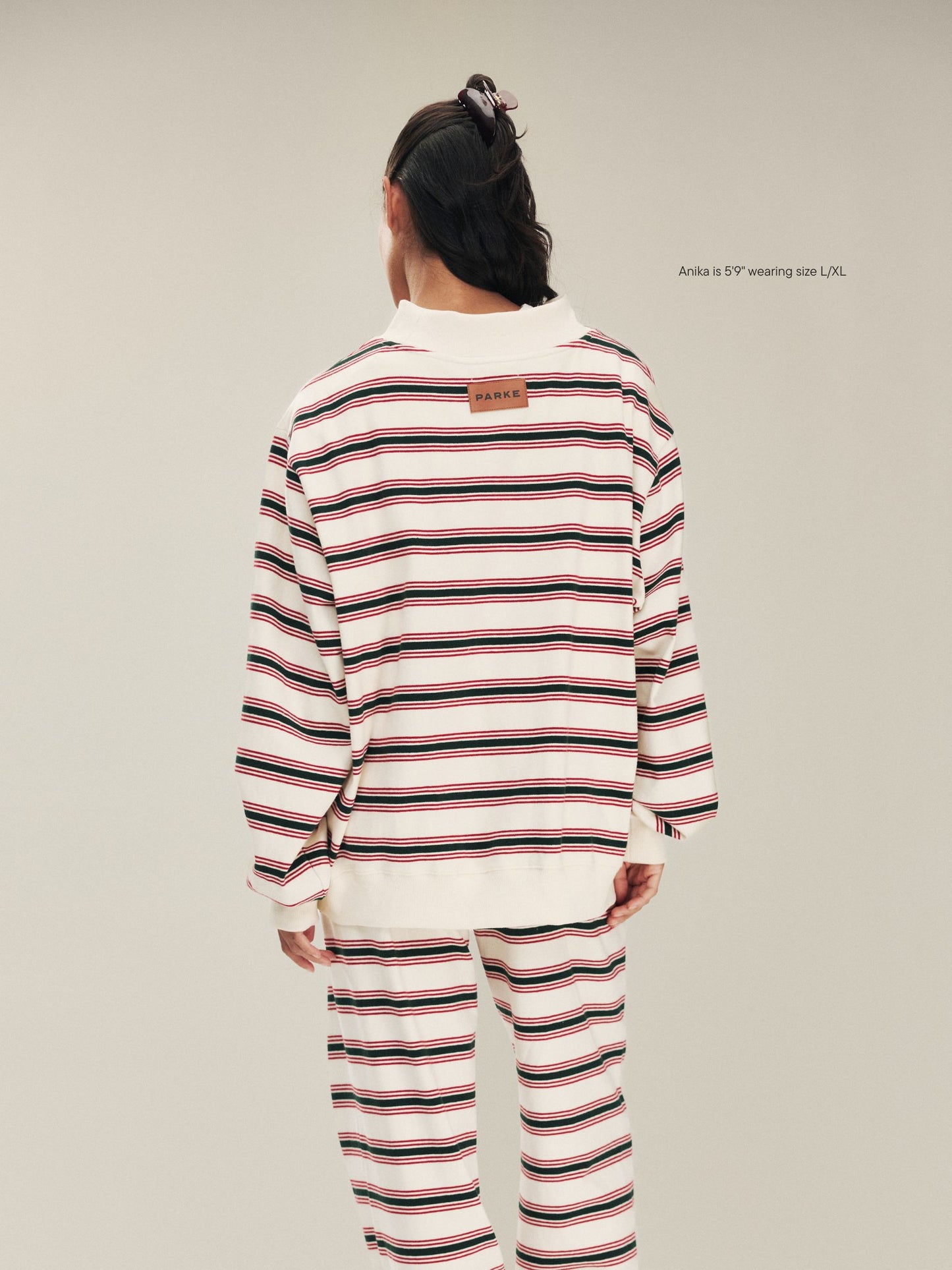 girl wearing Holiday Striped Pullover -eggnog stripe