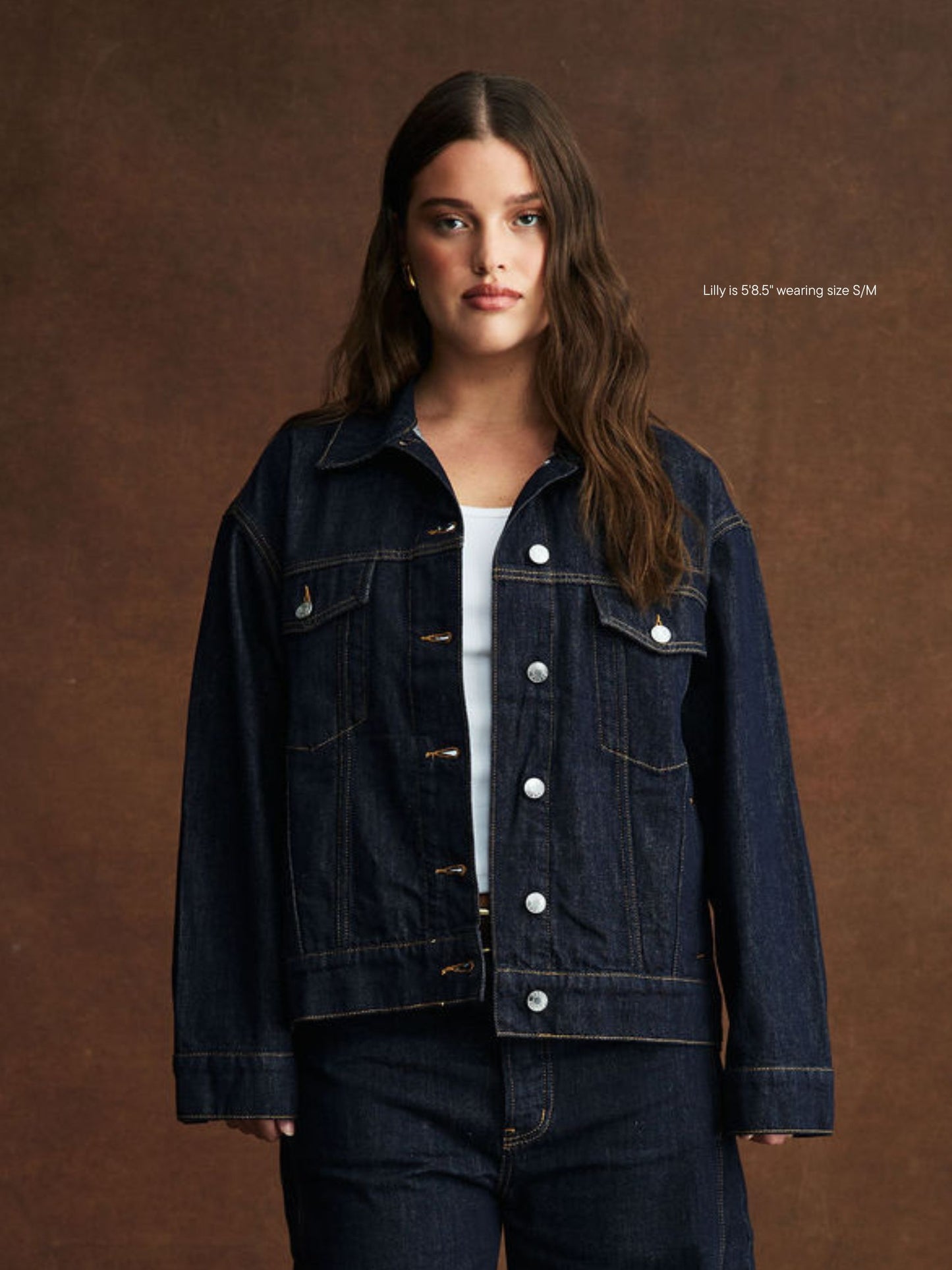 girl wearing oversized jean jacket -dark wash
