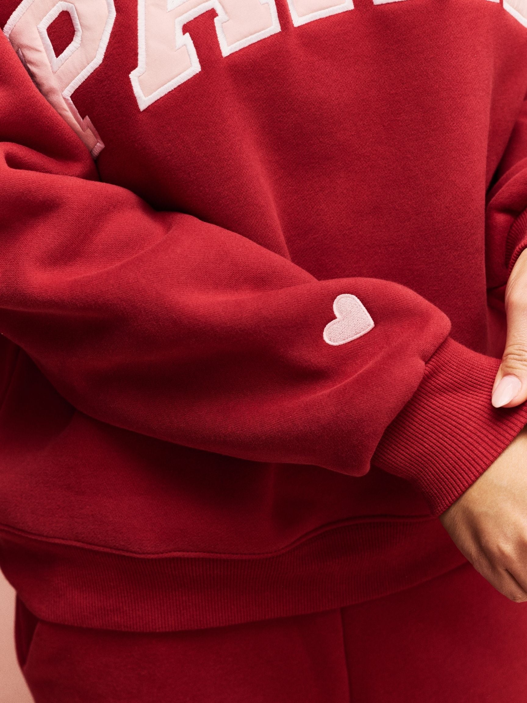 girl wearing Valentine's Varsity Mockneck -crimson + peony