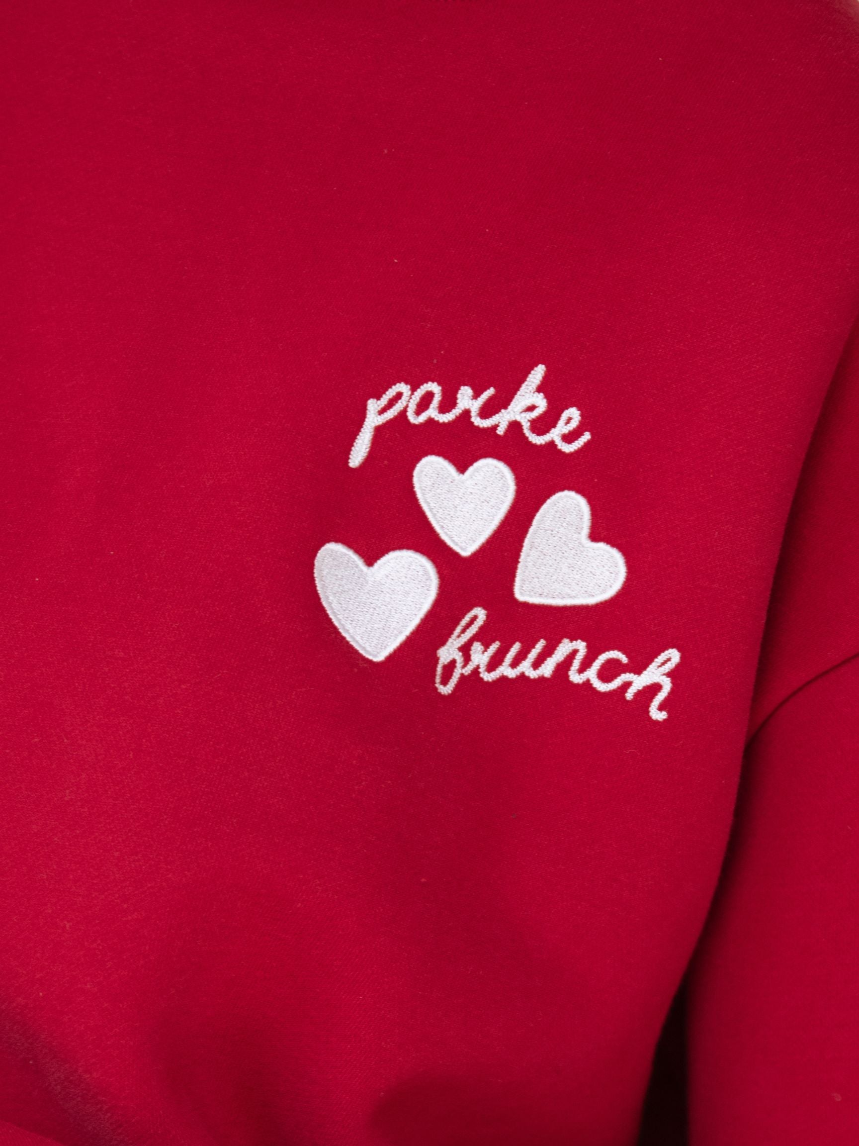 girl wearing Brunch Mockneck -red