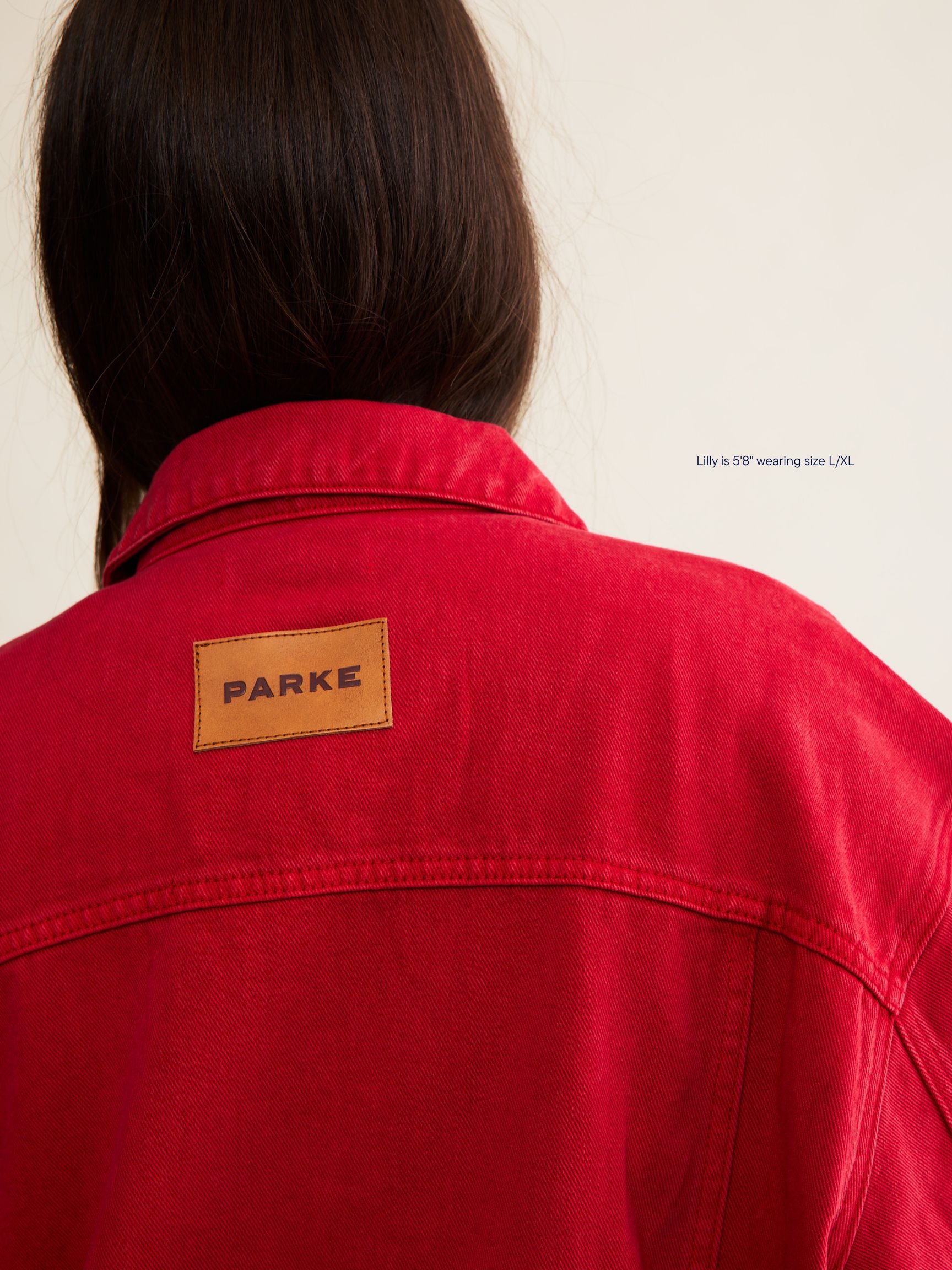 vintage wash girl wearing oversized denim jacket -washed red 