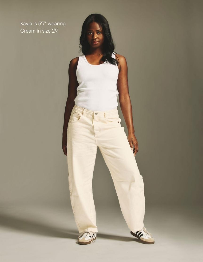girl wearing horseshoe jean -cream
