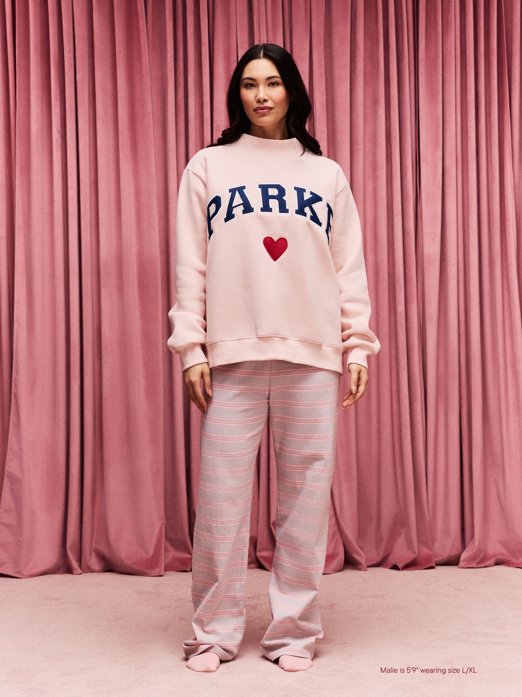girl wearing Heart Varsity Mockneck -peony + denim