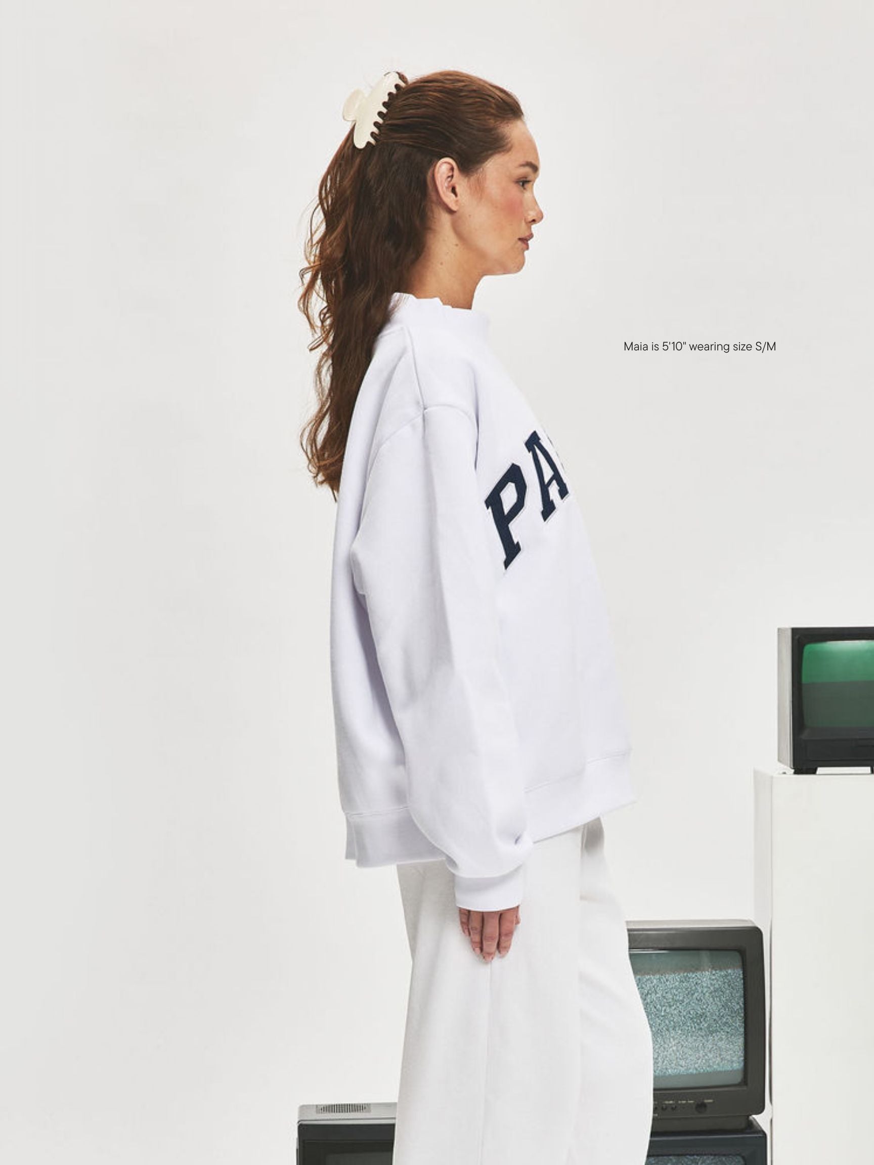 girl wearing Nostalgia Varsity Mockneck -white + denim