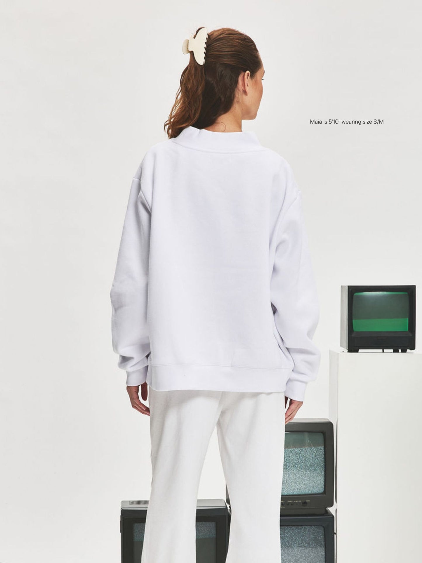 girl wearing Nostalgia Varsity Mockneck -white + denim