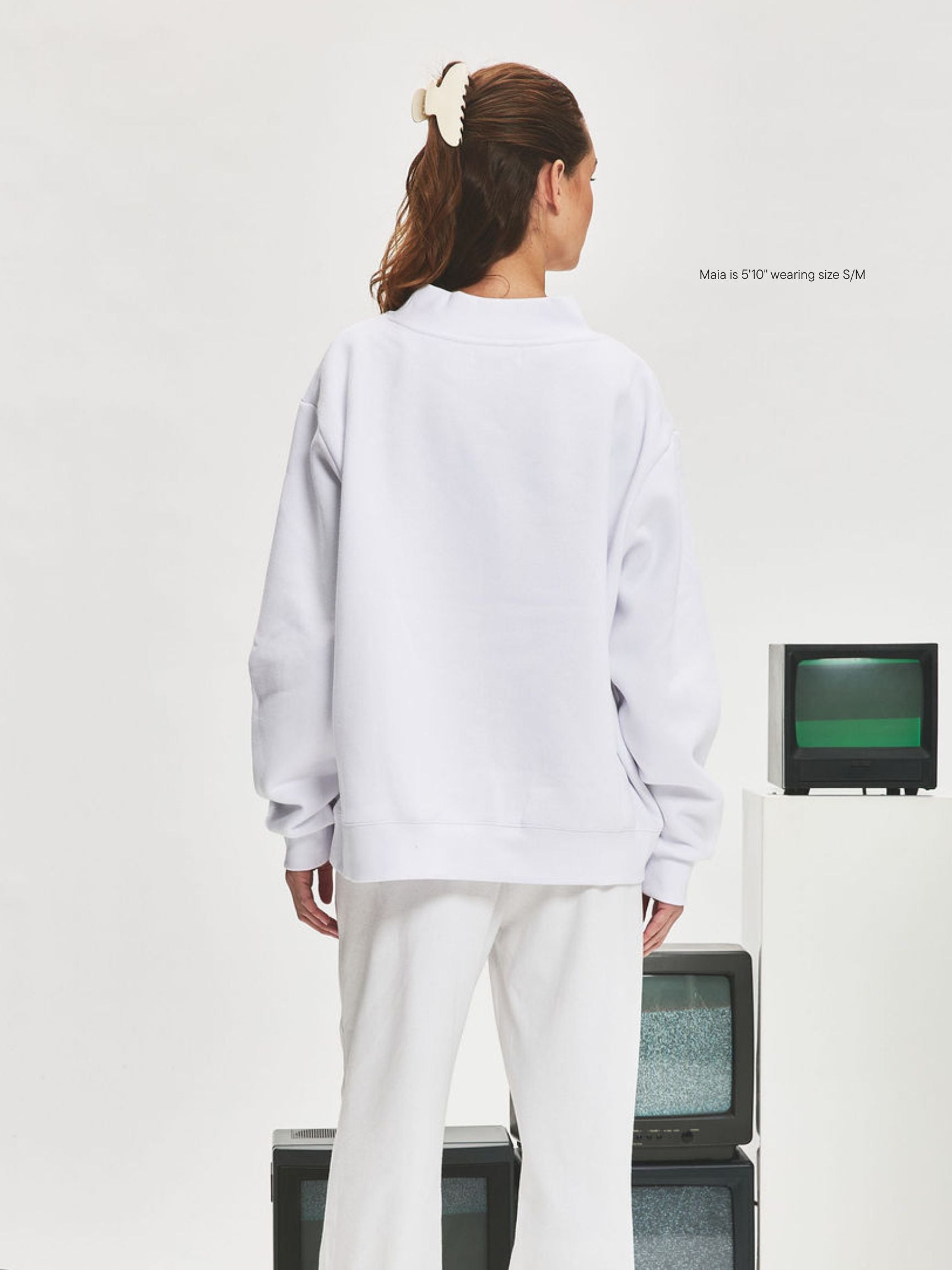 girl wearing Nostalgia Varsity Mockneck -white + denim