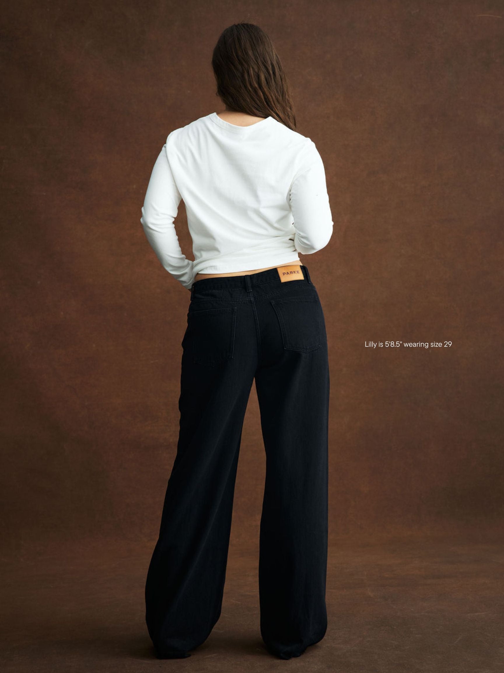 girl wearing Low Rise Baggy Jeans -black