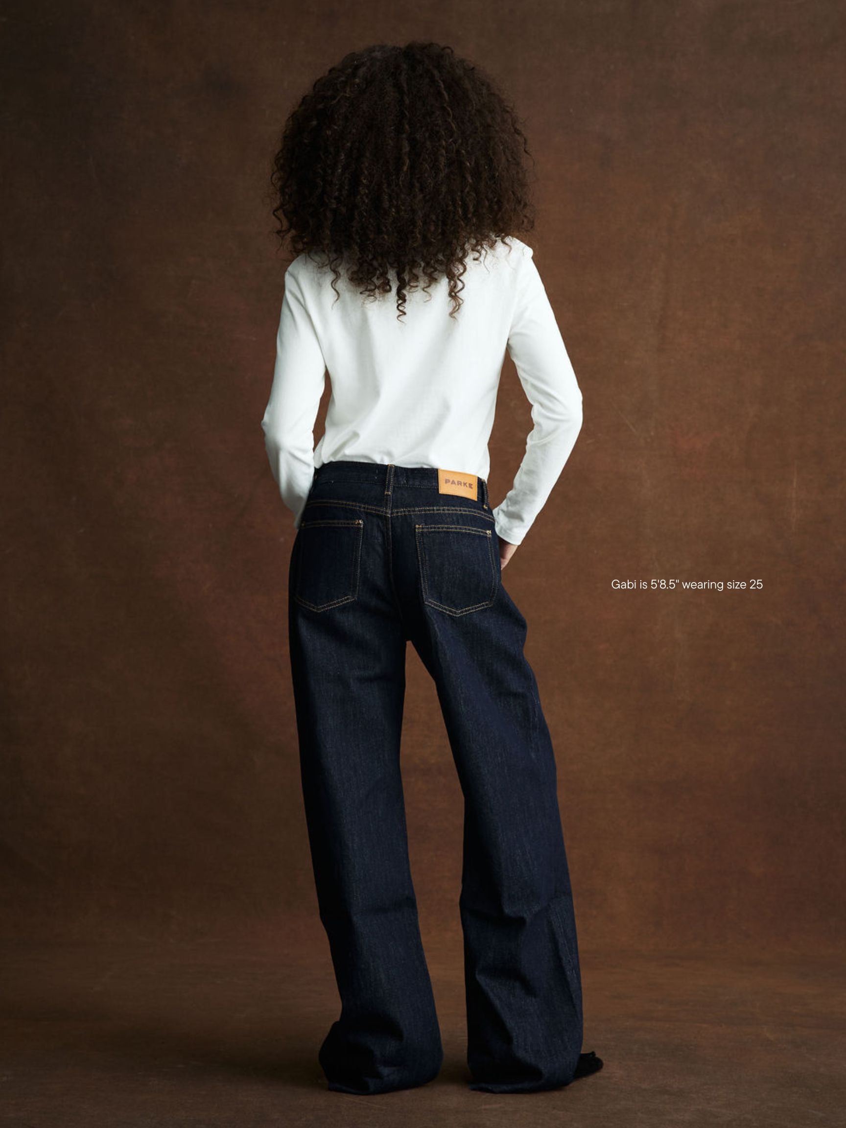 girl wearing Low Rise Baggy Jeans -dark wash