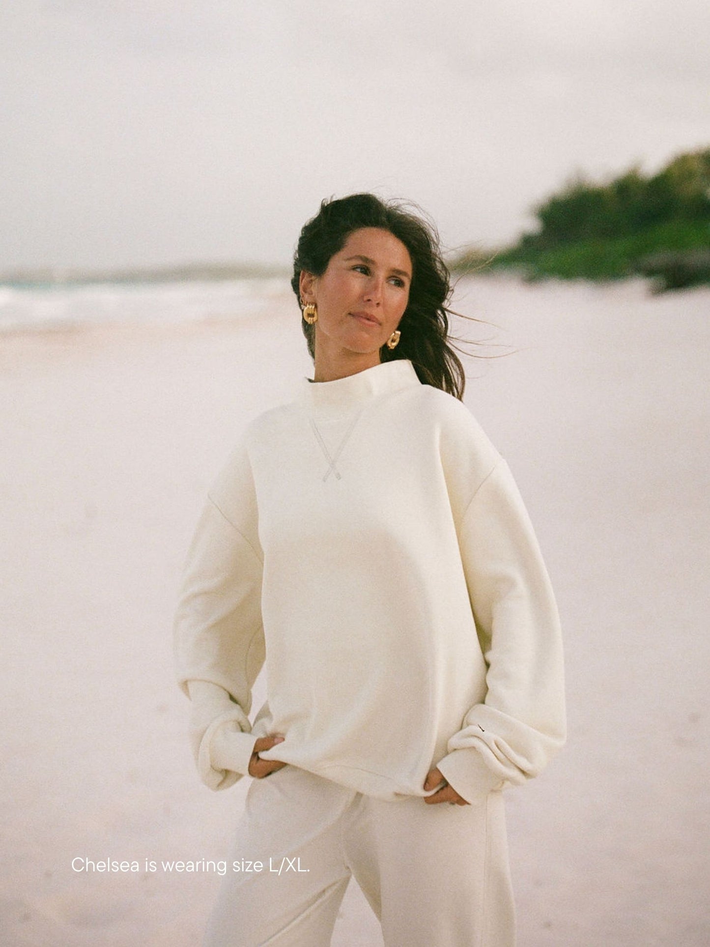 girl wearing heritage classic mockneck -cream