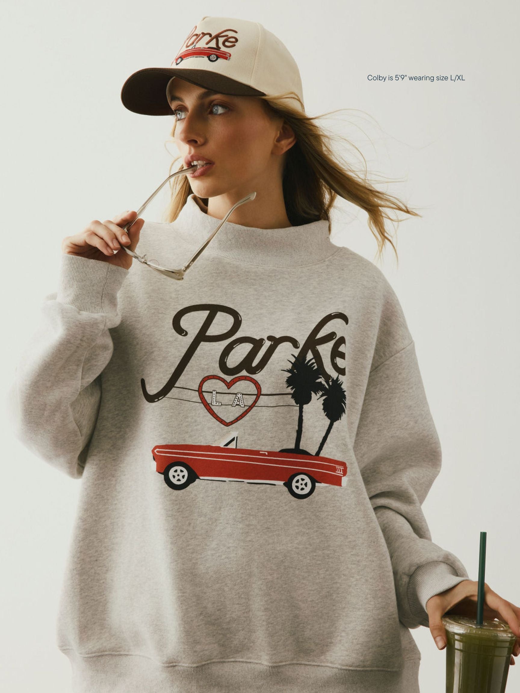 girl wearing Cities Graphic Mockneck -los angeles