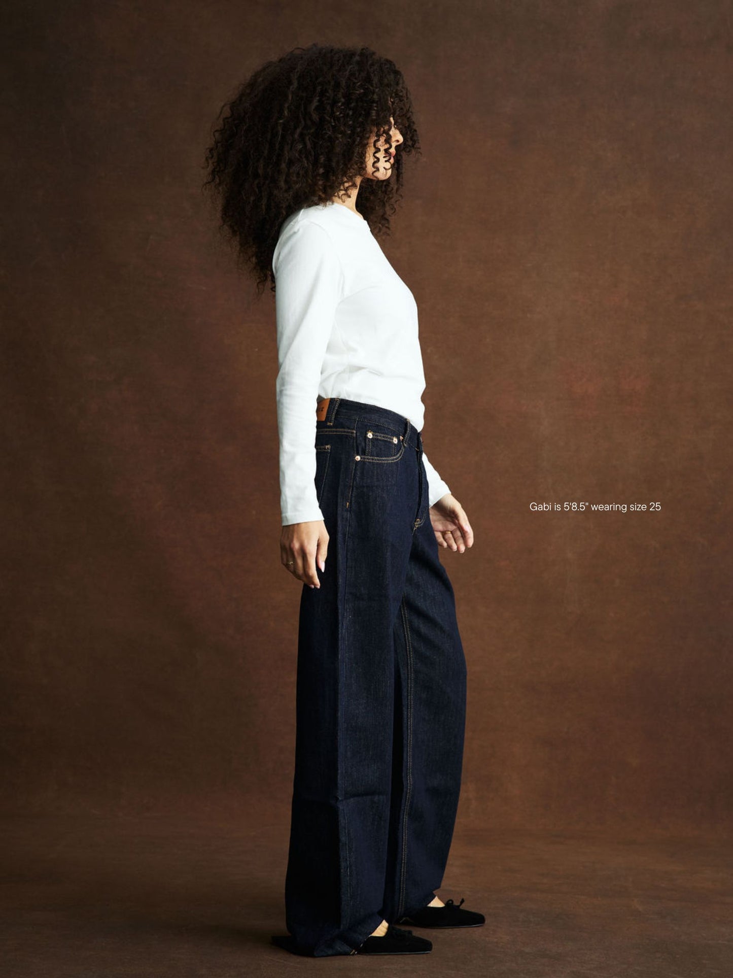 girl wearing Low Rise Baggy Jeans -dark wash