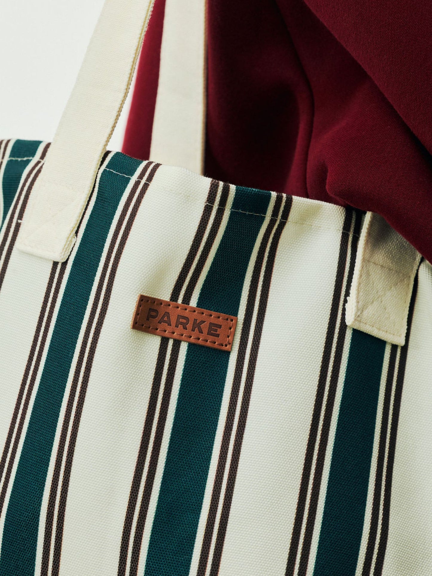 girl wearing Holiday Striped Tote -eggnog stripe
