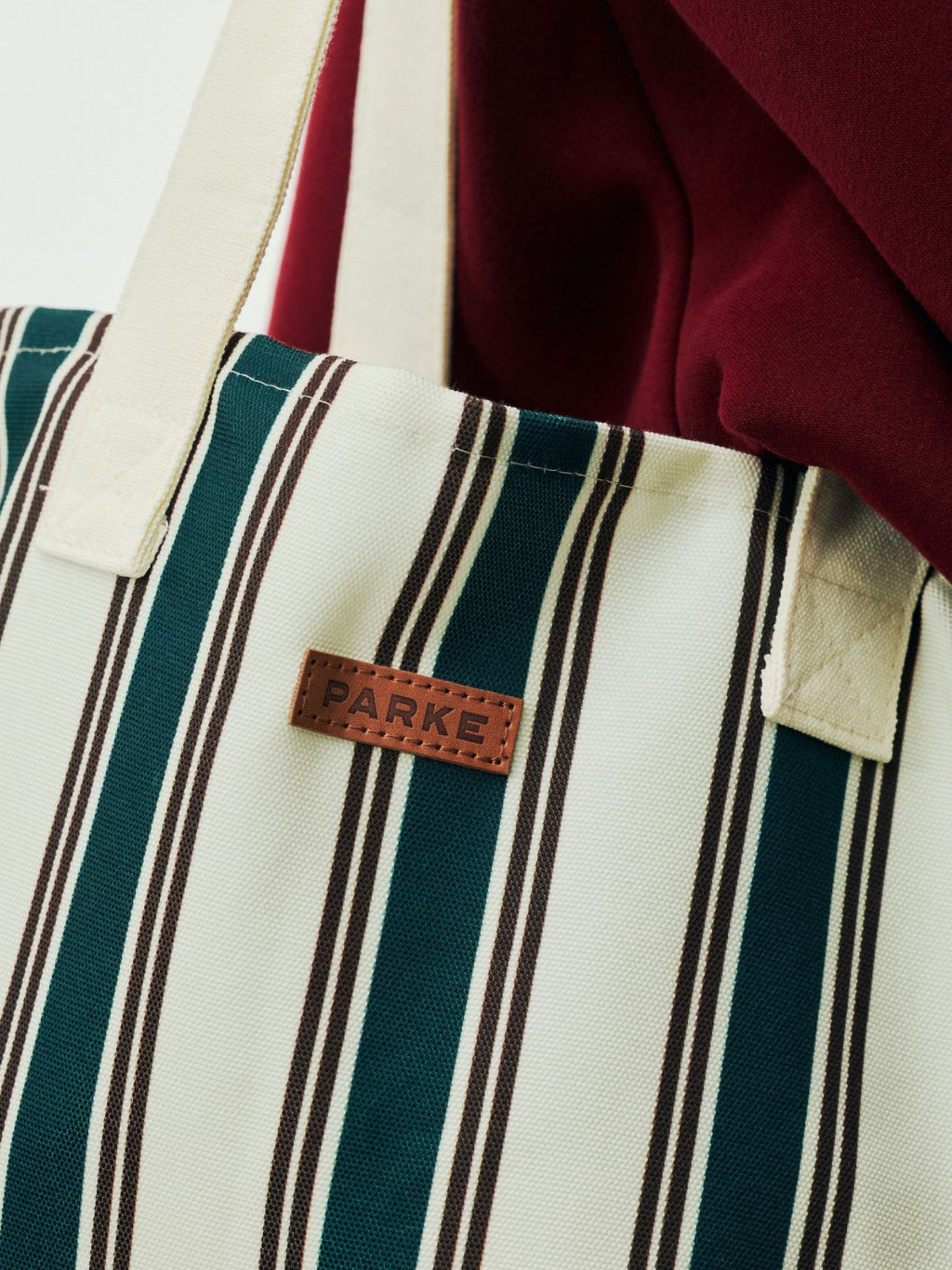 girl wearing Holiday Striped Tote -eggnog stripe