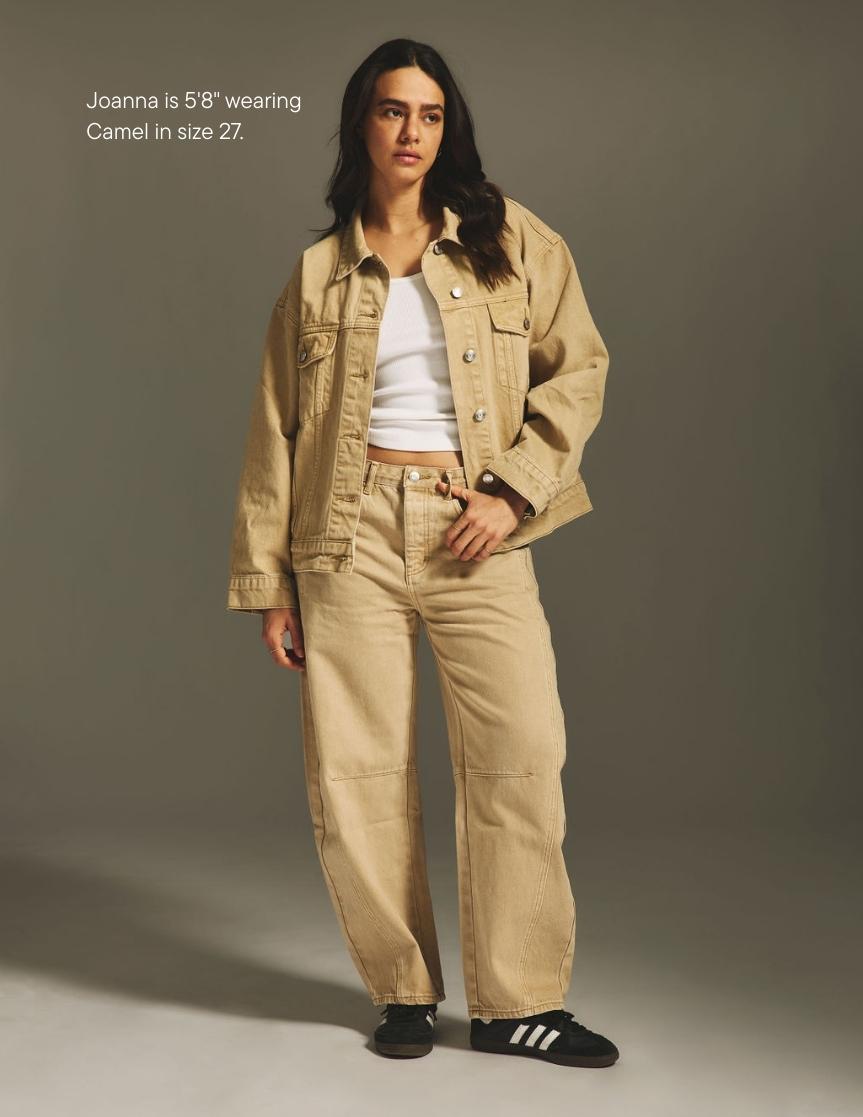 girl wearing horseshoe jean -camel