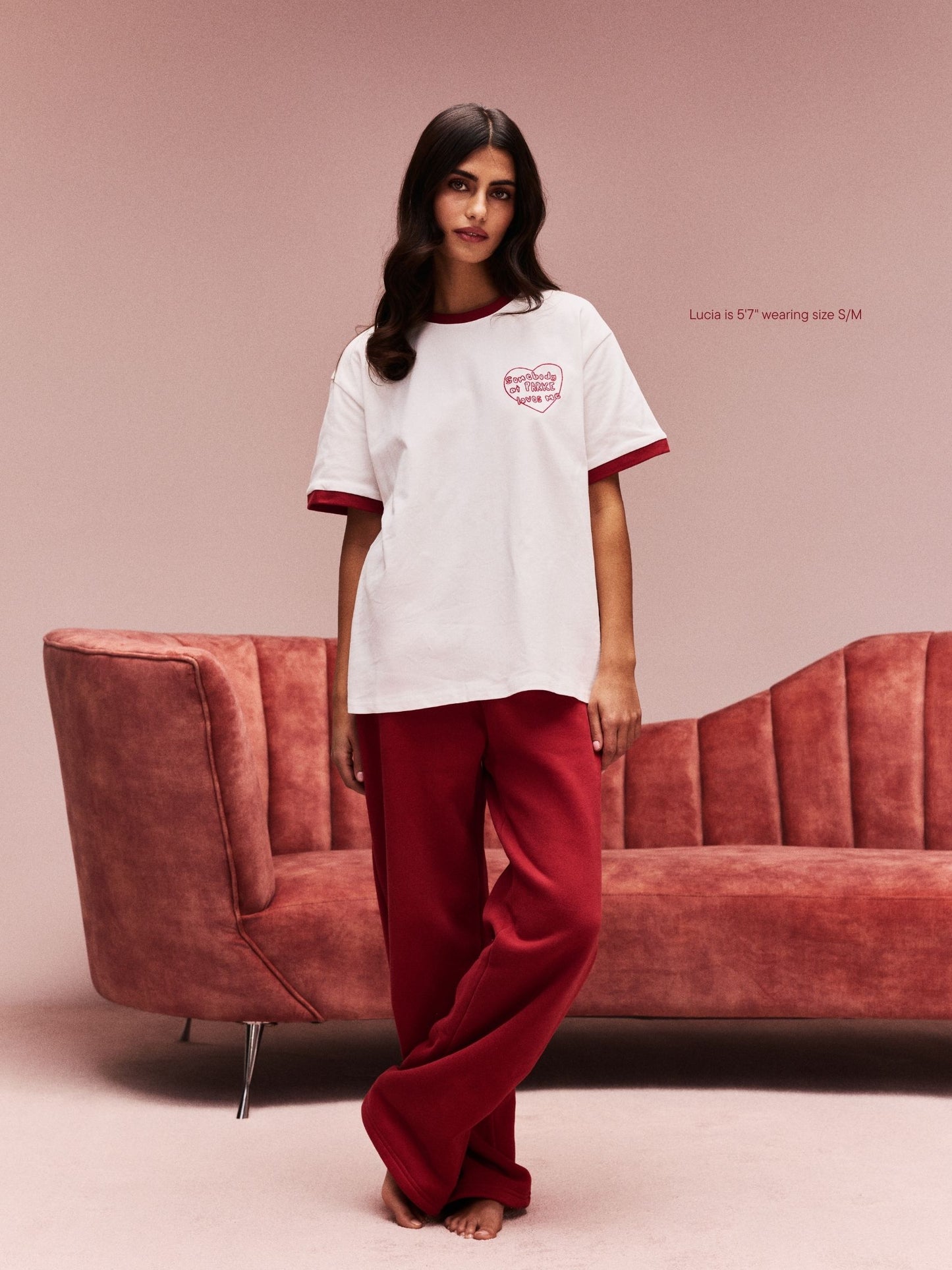 girl wearing Somebody Loves Me T-Shirt -white