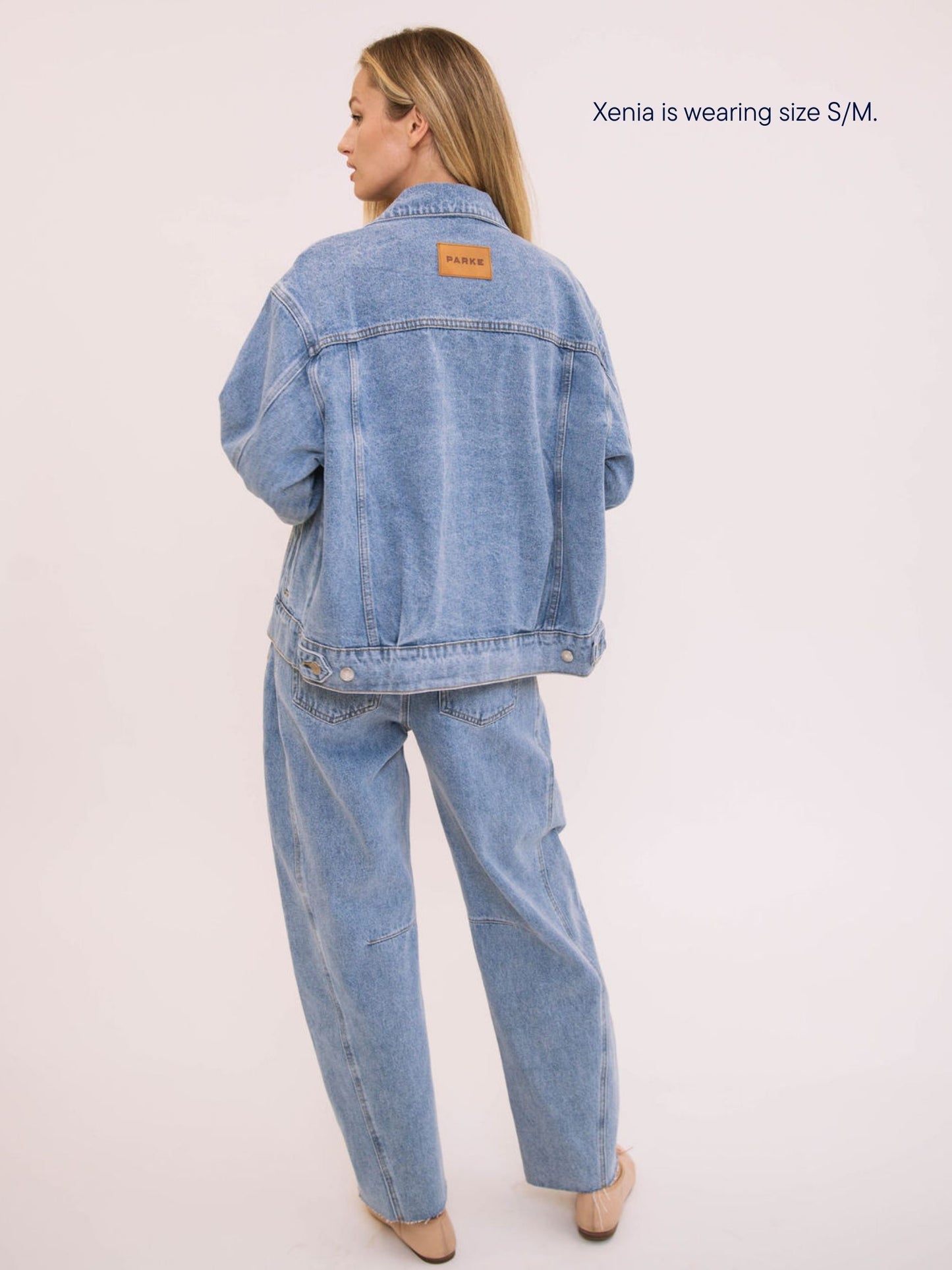 girl wearing parke x scl oversized jean jacket -vintage wash